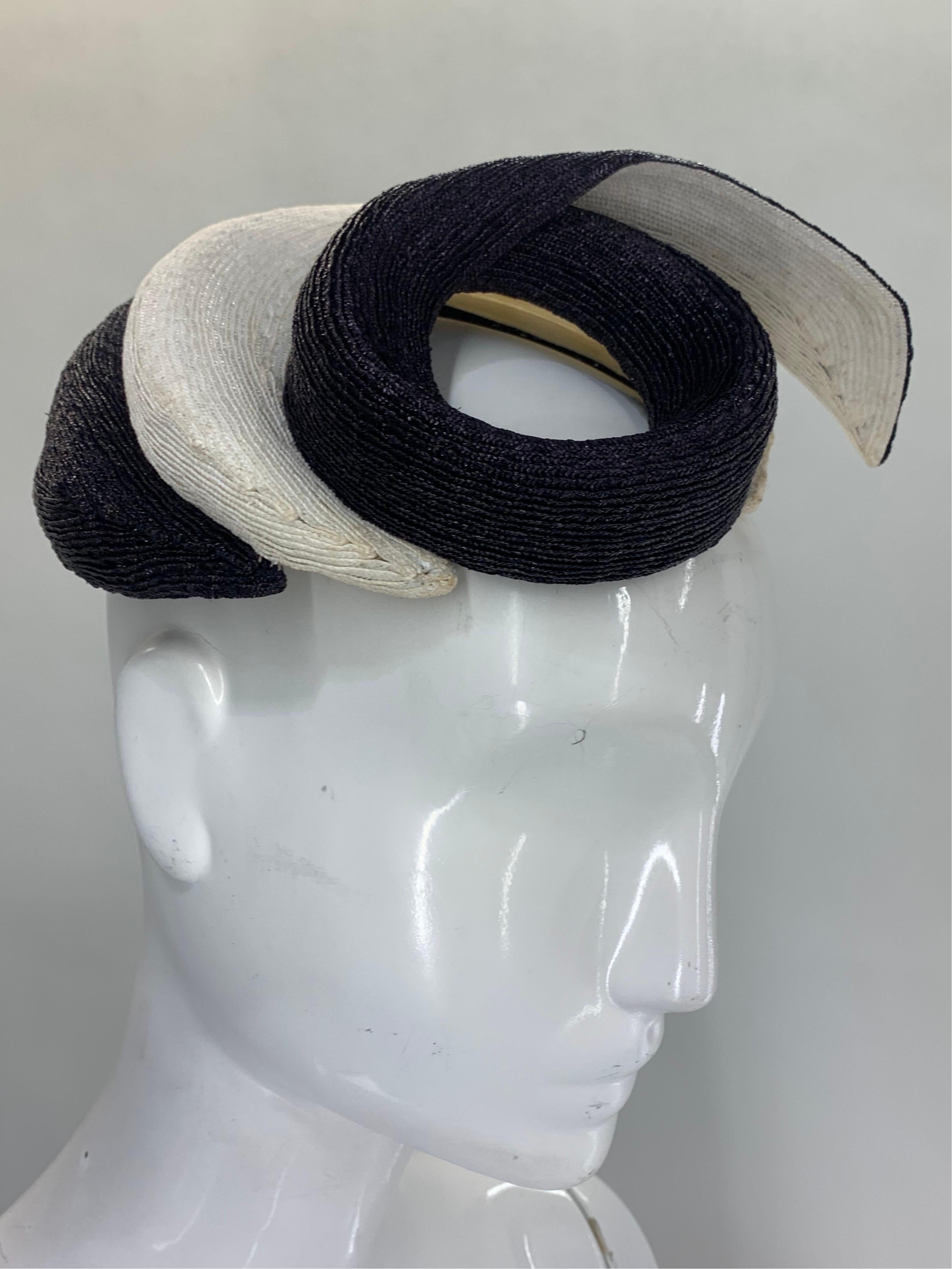 A fabulous 1950s Janette Colombier - Paris navy and cream spiral or corkscrew shaped straw hat or fascinator with a final standout flourish at top!  Original navy silk veil is unattached and can be worn with or without. Classic chic Jubilee-style!