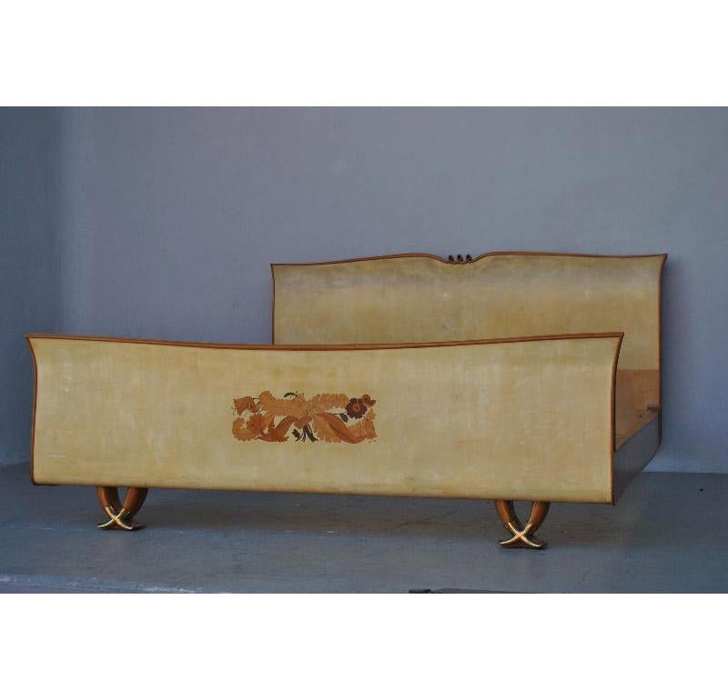 Large 1950s mahogany Cuban bed covered with parchment and decorated with flower marquetry by the famous Italian designer Paolo Buffa. Golden bronze clogs on the feet. Frame size 173 cm x 200 cm. Headboard height 100 cm, footboard height 61 cm.