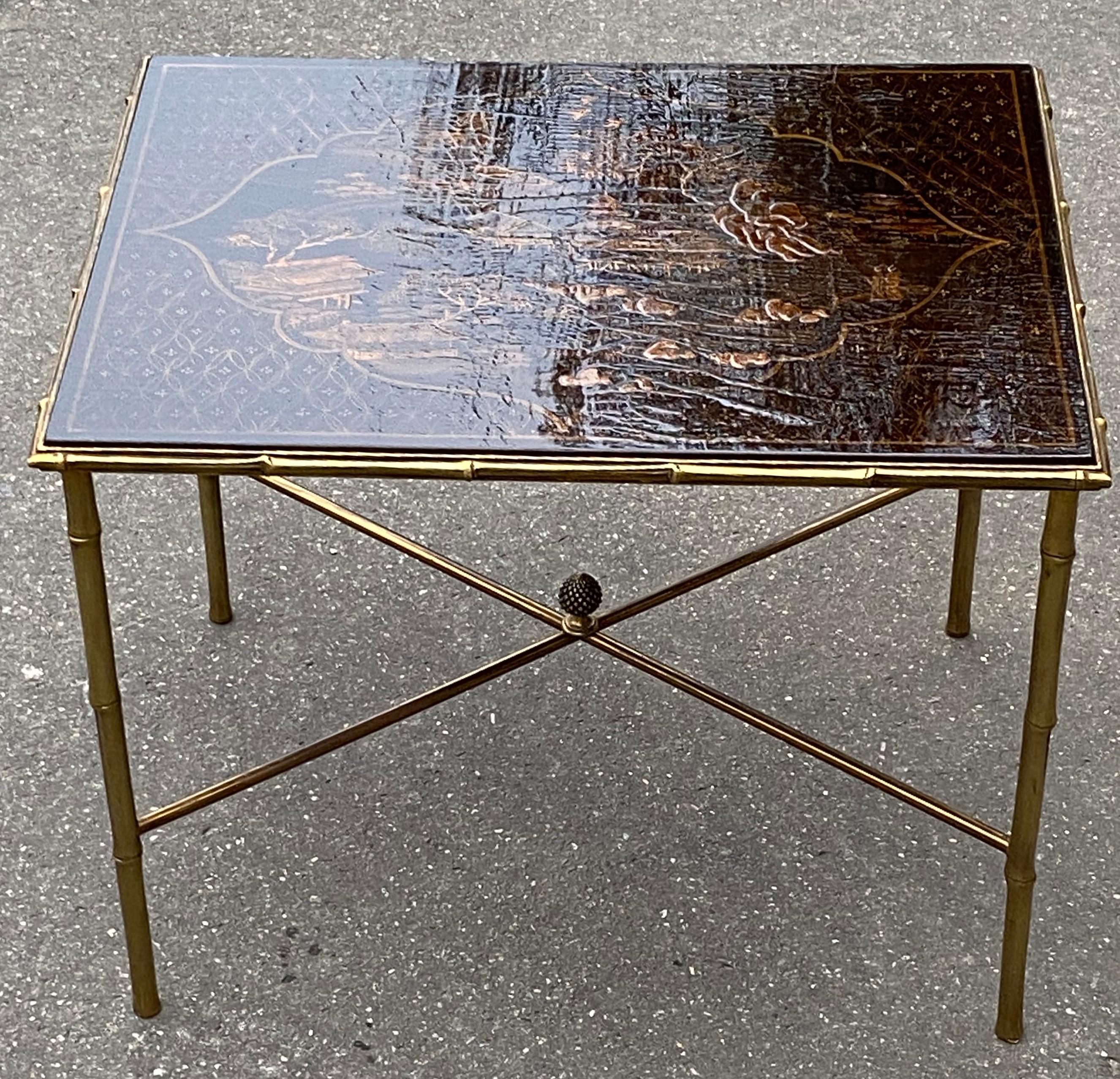 Gilded bronze table with bamboo decor with Chinese lacquer wooden top decorated with landscape, pagodas, birds
Spacer with pine cone
Circa 1950, Good condition made by Maison Bagués ou Jansen
Everything is screwed, removable, easy to send all