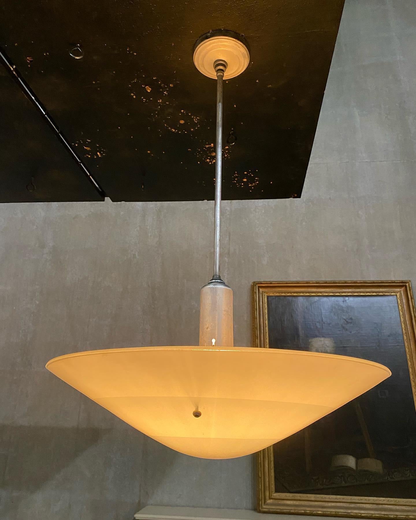 Very nice set of 6 large glass pendants on aluminum stems with original ceiling caps.Found in a commercial building in Missouri. This size is unusual.

Possibly made by Miller Light Co. 

 Rewired tested and easy install.