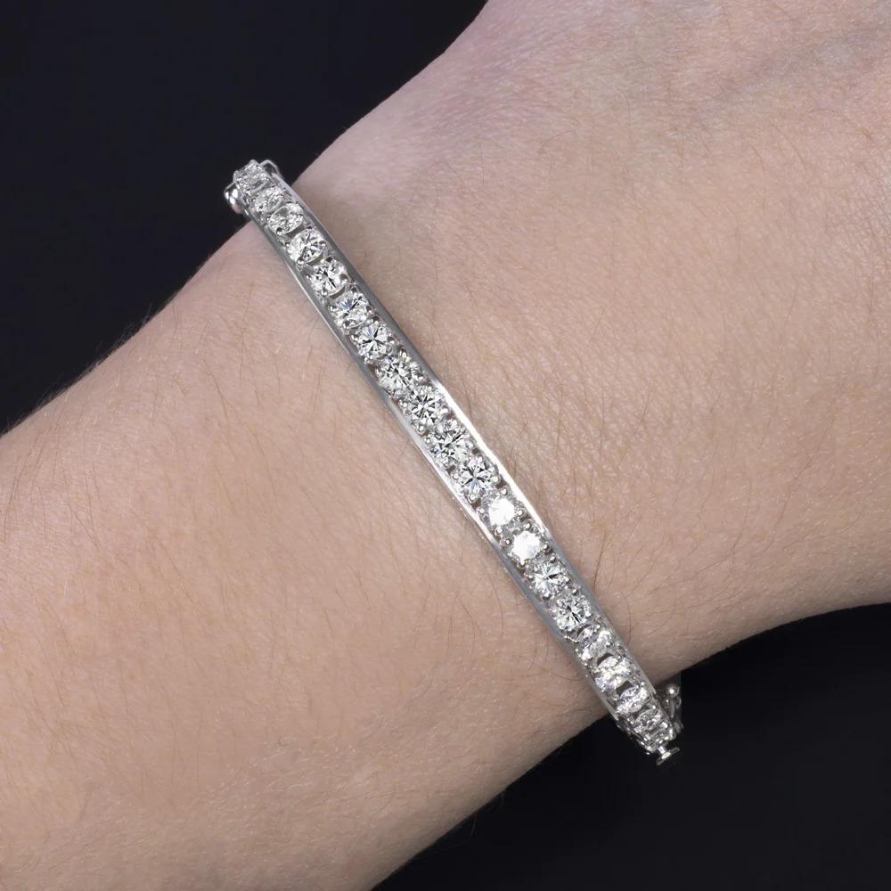 vintage diamond bracelet offers vibrant sparkle with 2.5 carats of diamonds, and a luxurious, substantial feel.

Highlights:

- Original vintage

- Bright white and eye clean diamonds

- Satisfying weight at 15.8 grams

- Handmade in 14k white