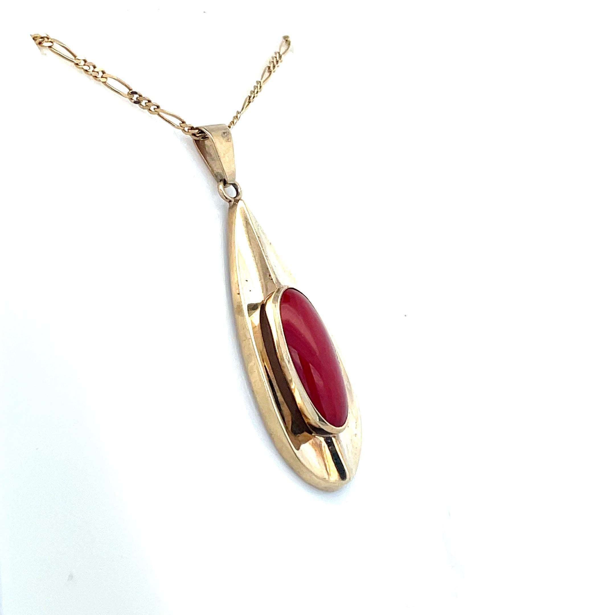 Intense Un-Dyed Red Coral Pendant 1950s Mid Century 

This is an extraordinary 1950 un-dyed intense red coral pendant, encased in lustrous yellow gold. This mesmerizing piece is a testament to the beauty and allure of natural coral, showcasing its