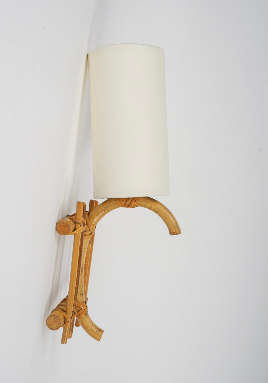 Rope 1950 Pair of Louis Sognot rattan sconces For Sale