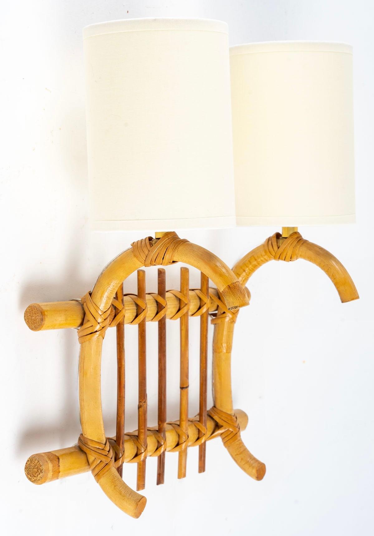 Mid-20th Century 1950 Pair of Louis Sognot Rattan Wall Lamps