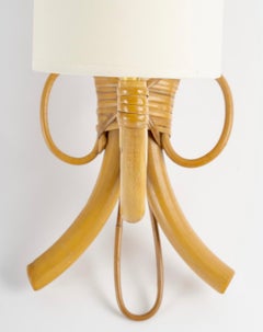 1950 Pair of rattan wall lamps by Louis Sognot