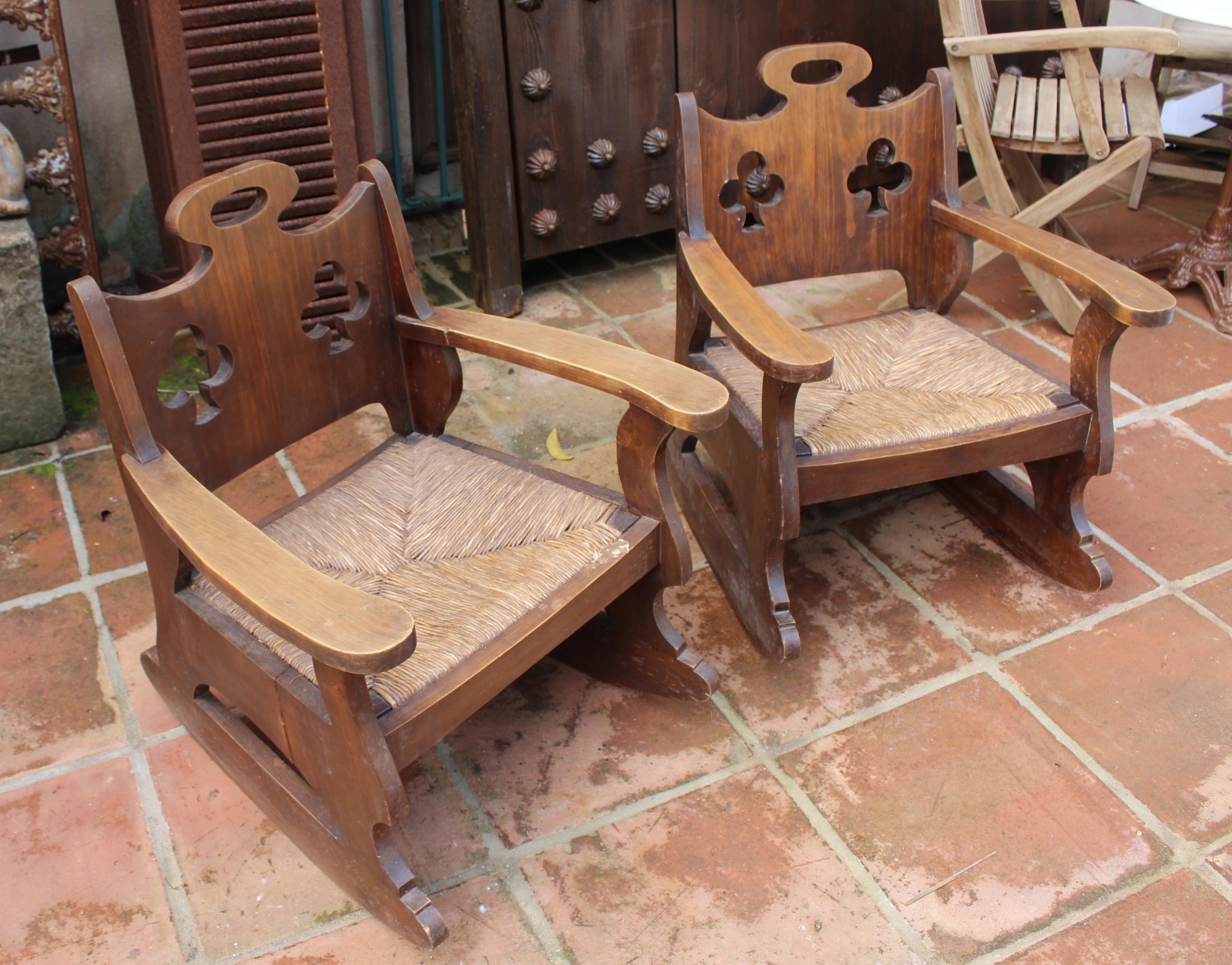 1950s pair of Spanish hand woven rattan rocking chairs.