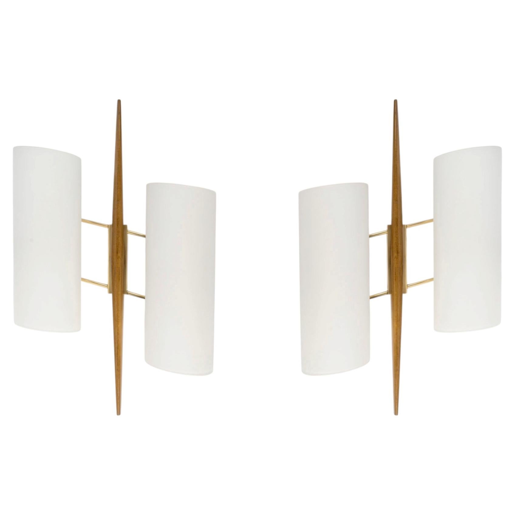1950 Pair of spindle-shaped wall sconces by Maison Arlus For Sale