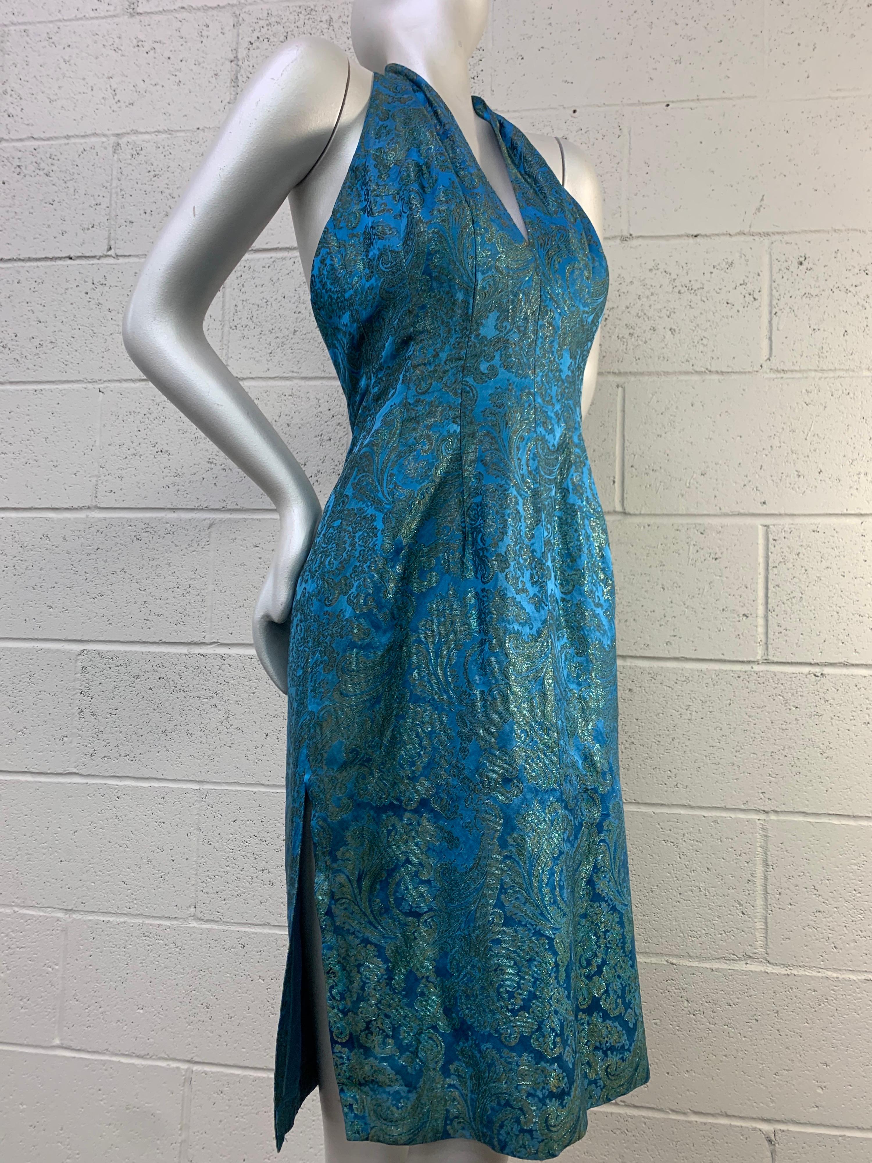 A beautiful 1950s azure silk brocade halter cocktail sheath dress and jacket ensemble attributed to Philip Hulitar with no labels present. Low-cut back and back zipper. Fully lined. Size 8. 