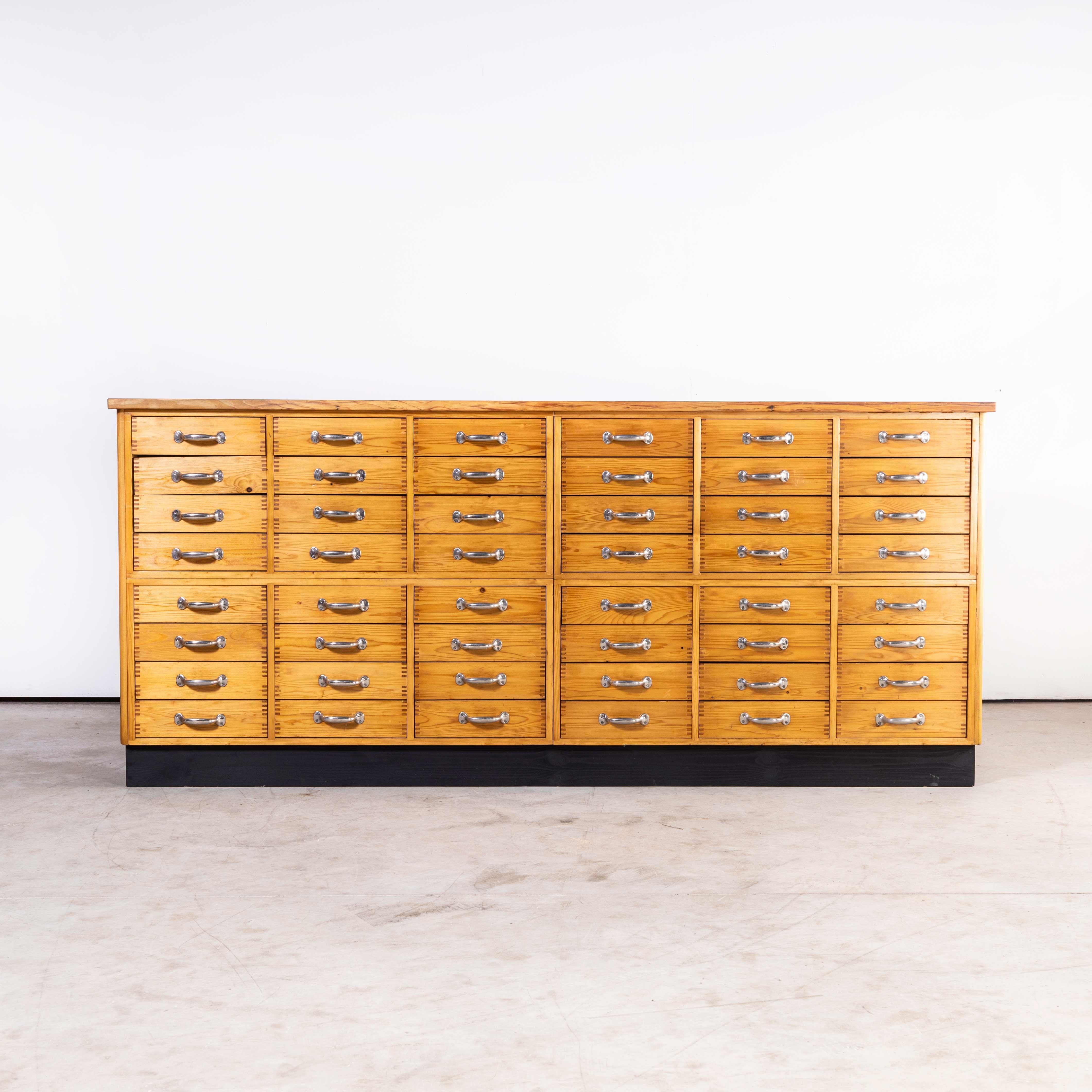 1950 Pine 48 drawer laboratory bank of drawers
1950 Pine 48 drawer laboratory bank of drawers. Lovely clean functional drawer unit from a college laboratory. The top and sides are lovely rich characterful pine, the rest of the unit is in
