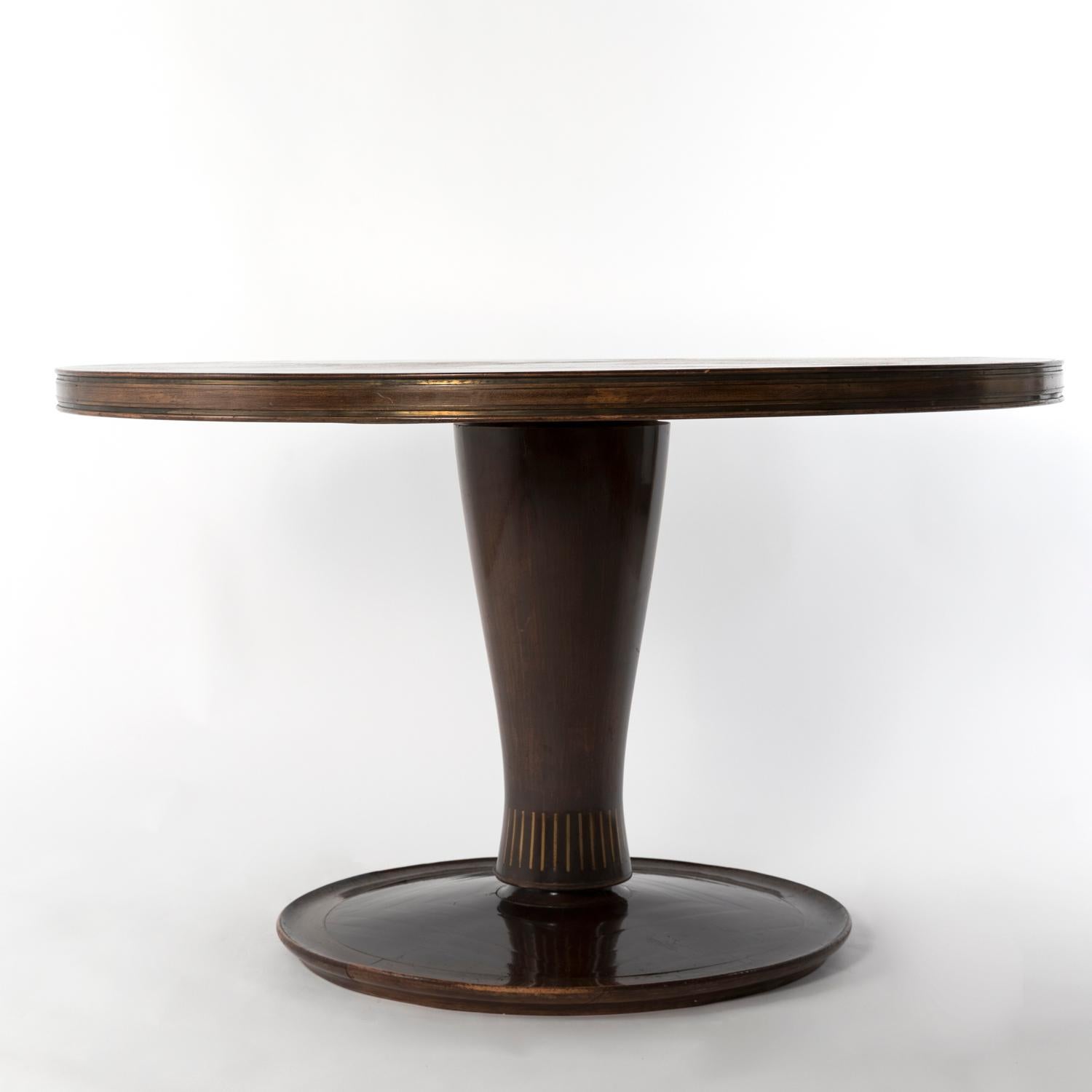 1950 dining table designed by Giovanni Gariboldi for Colli, Turin. Made from Bubinga wood and inlayed brass, it comes from a private commission in Turin. This piece could be delivered after a professional restoration by adding 1000€ to listed