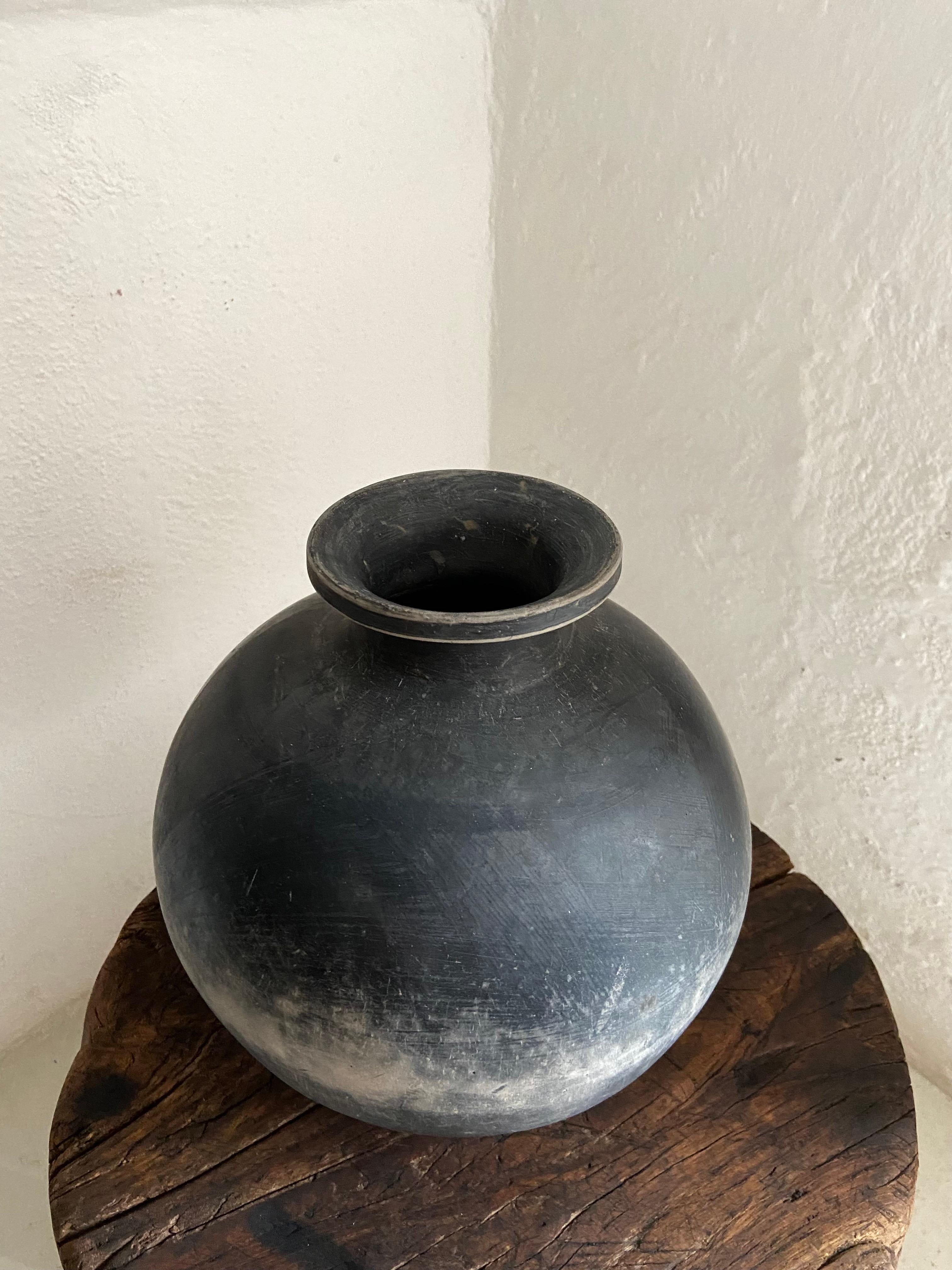 1950's Mezcal vessel from San Bartolo Coyotepec, Oaxaca (Mexico). This style of utilitarian pottery was hand crafted until the 1960's with the introduction of plastics. New designs are now available in the way of commercial folk art. The pot comes