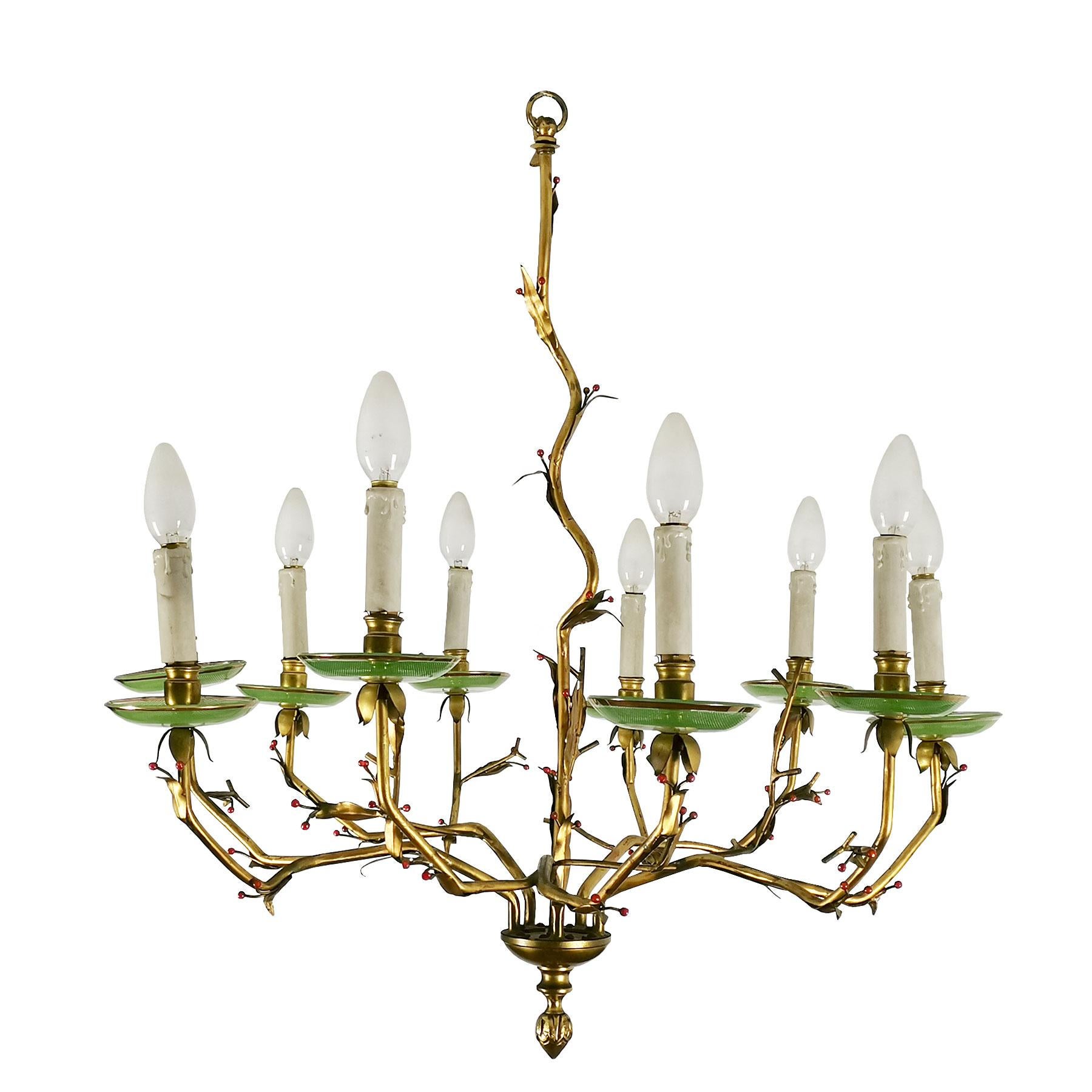 Chandelier with 10 branches in golden bronze, leaves and small false coral balls decoration. Acid engraved glass saucers with a golden line and original false candles.

Spain, circa 1950.
