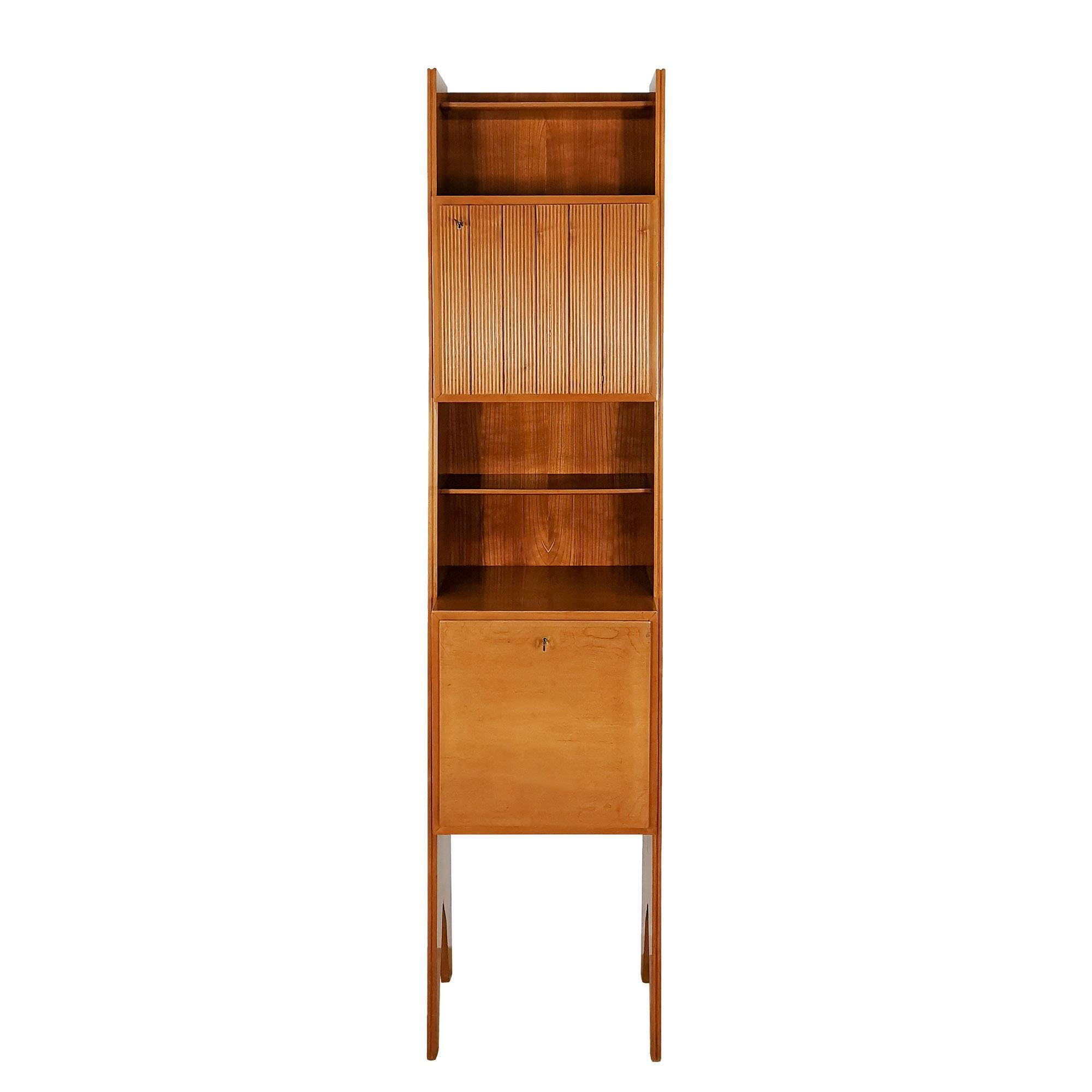 Cherry wood bookcase with shelves, one door with grissinis decoration and one flap door.

Italy c. 1950.