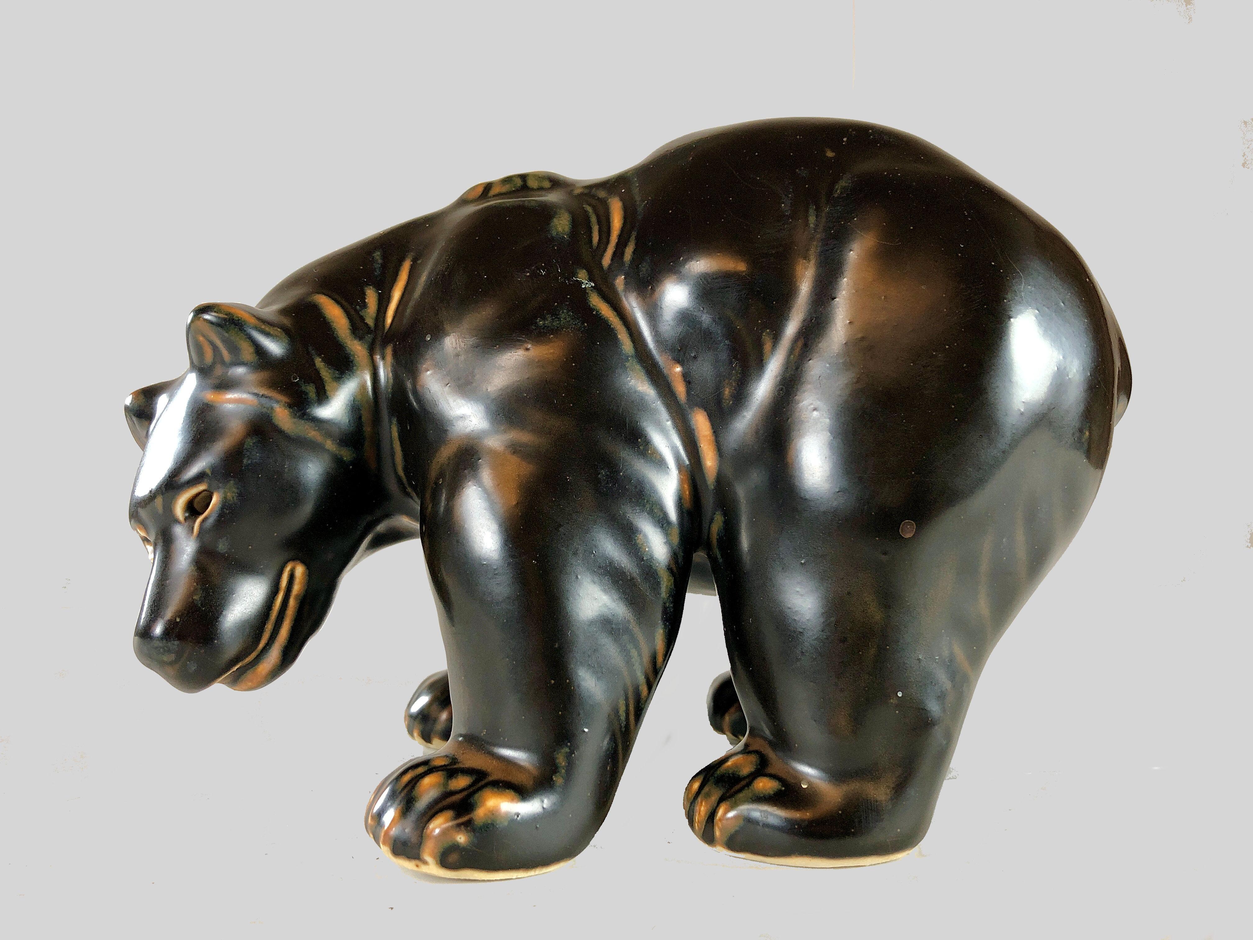 Danish Knud Kyhn bear figurine for Royal Copenhagen

The lively bear was created by Knud Kyhn (1880-1969) in 1957. Knud Kyhn worked for for Royal Copenhagen from 1903-1910, 1924-1932 and 1936-1967. During this period he created many figures of