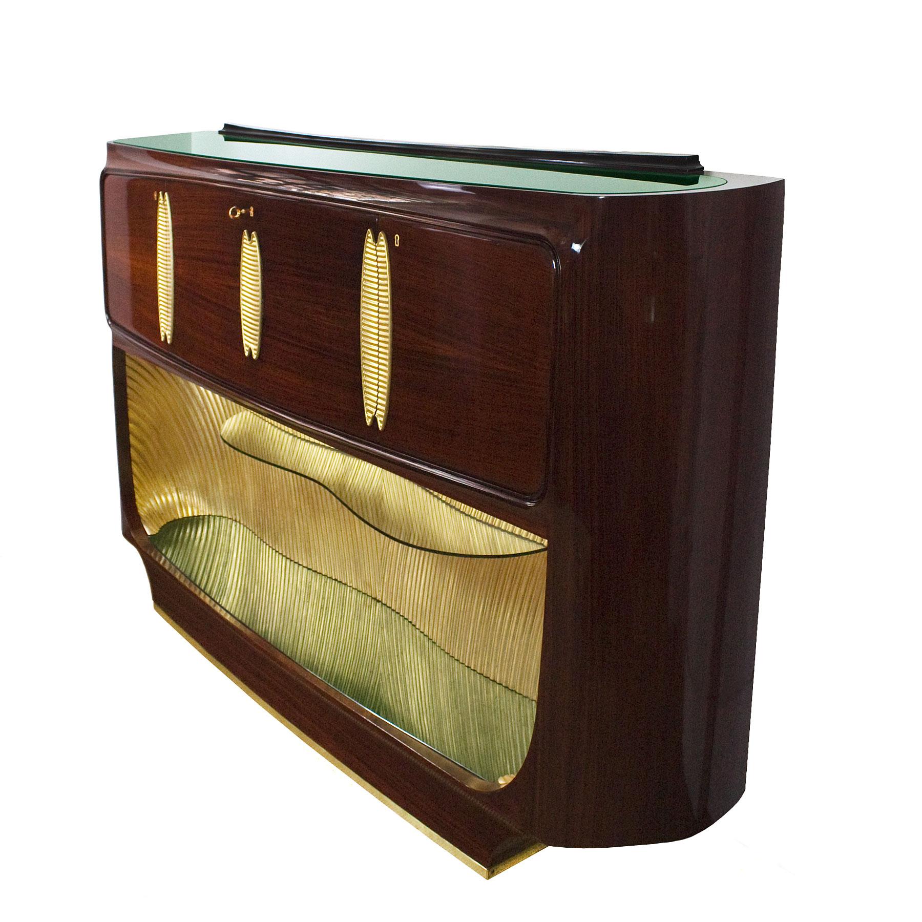 Spectacular rounded dry bar, solid wood with mahogany veneer, French polish. Gold leafing solid wood decorations on doors and at the lower part. Central door with mirrored and sycamore veneered bar. Side doors with storage spaces. Glass shelf in the