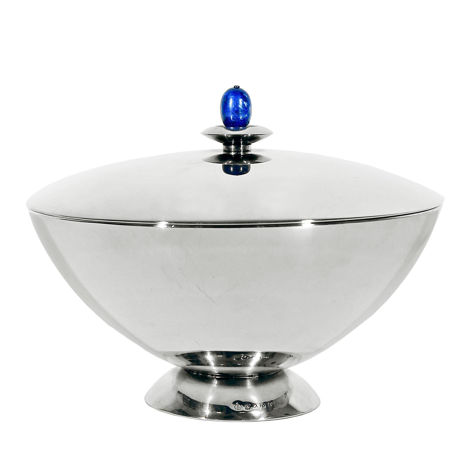 Sterling silver sweet box, lapis lazuli cabochon. Design: A. y J. Torres, Barcelona. Weight: 450 grs. Stamps: 45B - Star - A. y J. Torres. 
Star stamp in Spain is for sterling silver since 1934.
Spain circa 1950.