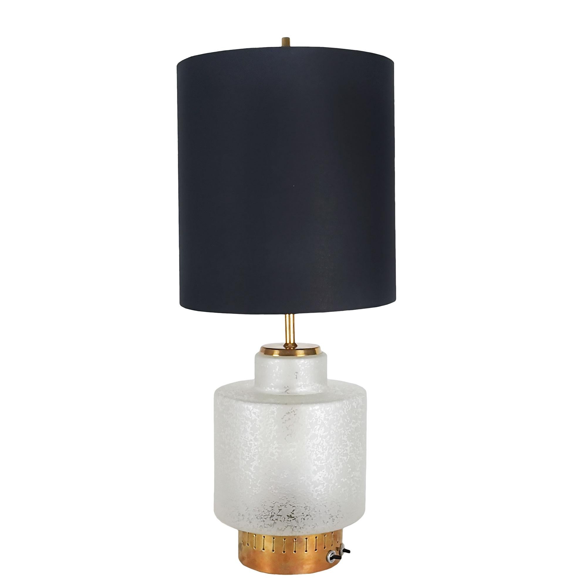 Table lamp with polished brass structure and acid worked glass, double lighting system, lampshade adjustable in height by an ingenious sliding system. Lampshade redone in black fabric with golden interior. Splendid work.
Manufacturer: