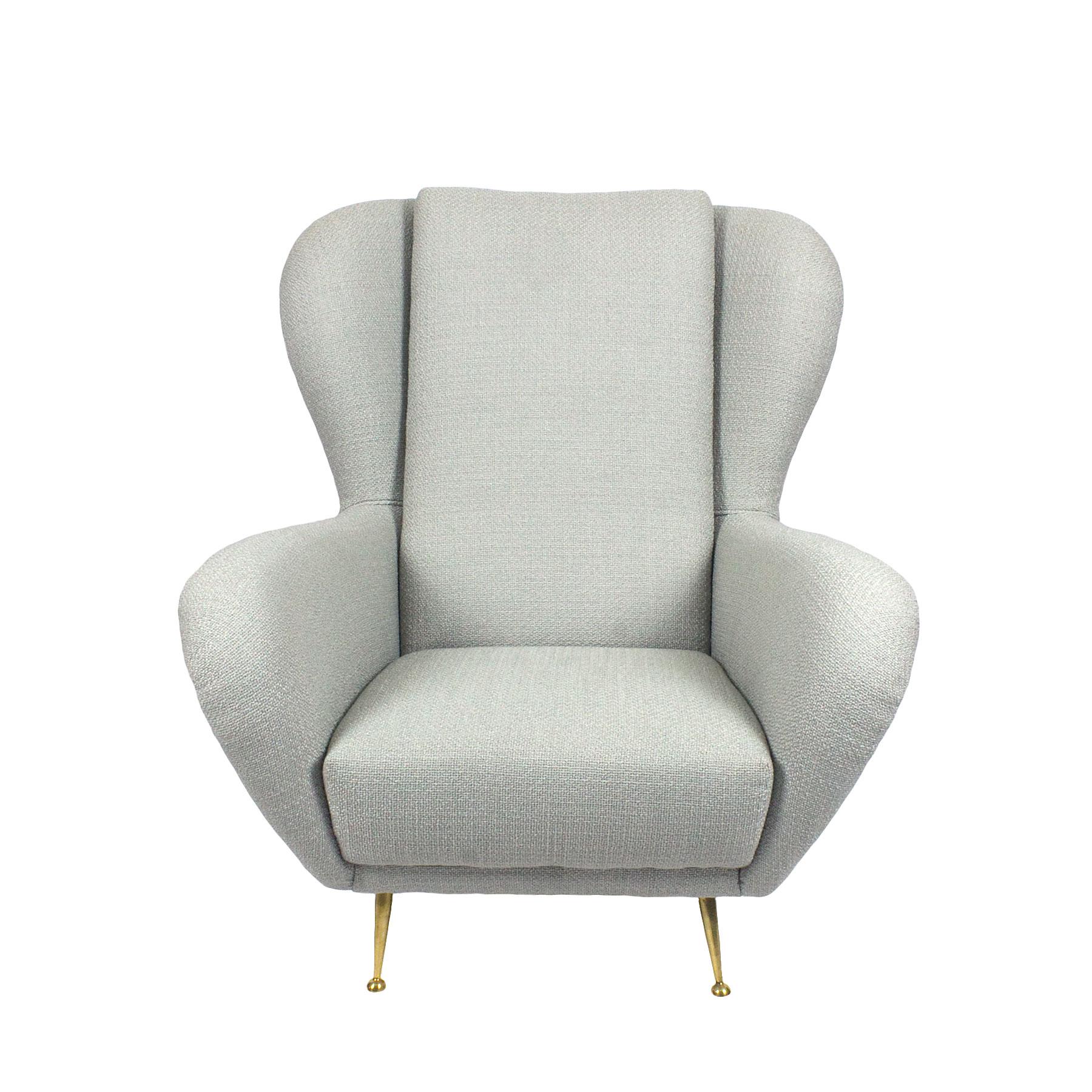 Wing armchair, completely restored and upholstered with a light grey polyester fabric. Polished brass feet.
Maker: I.S.A.

Italy, circa 1950.