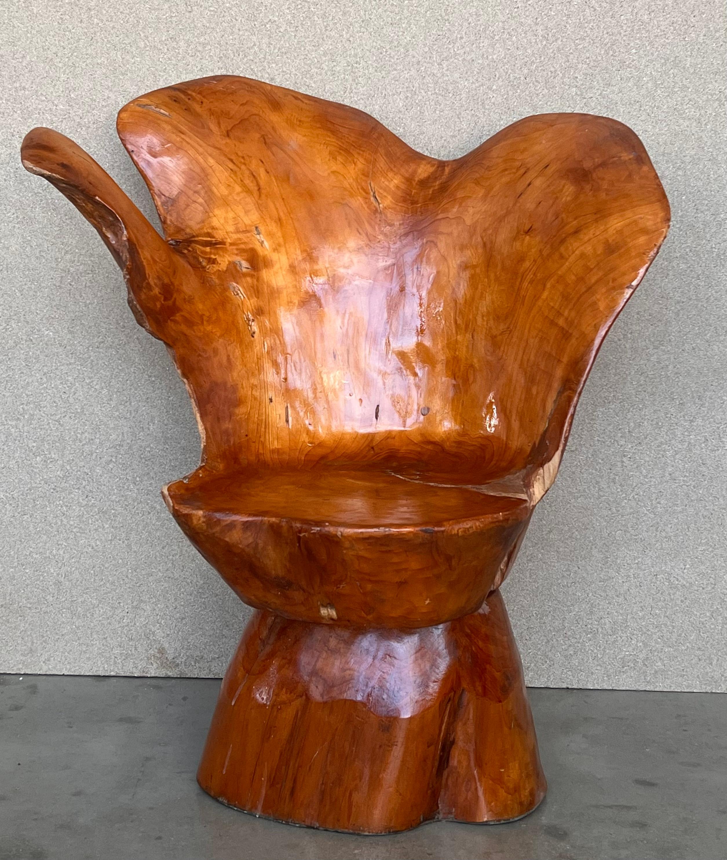 Midcentury Abstract Chinese style wood root armchair 
Really very comfortable piece.
We have 4 armchairs available and a a table
The wood was carved to create a seat among the roots of an actual camphor tree. This totally unique chair features a