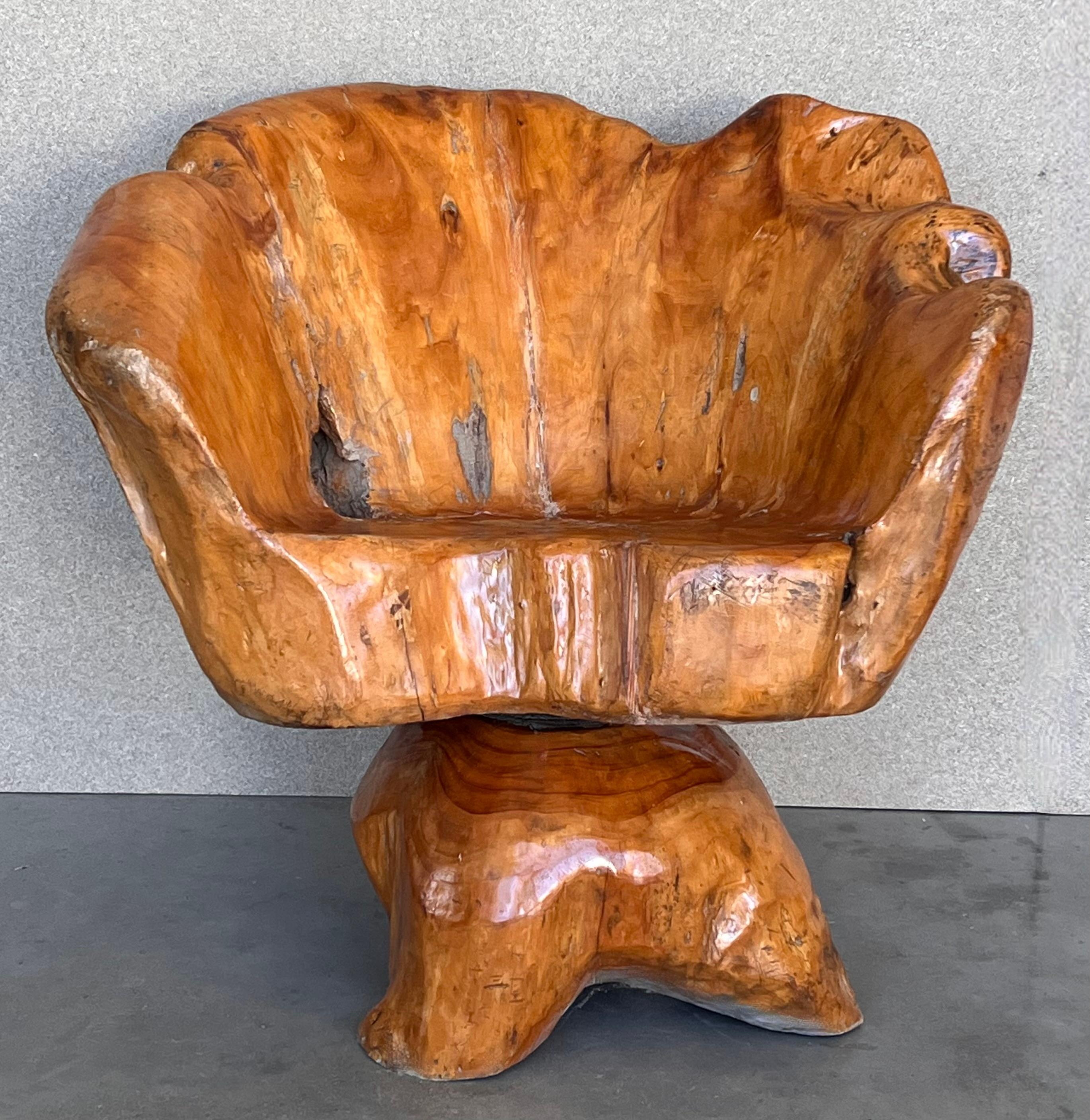 Mid-century Abstract Chinese style wood root armchair 
Really very comfortable piece.
We have 4 armchairs available and a a table
The wood was carved to create a seat among the roots of an actual camphor tree. This totally unique chair features a