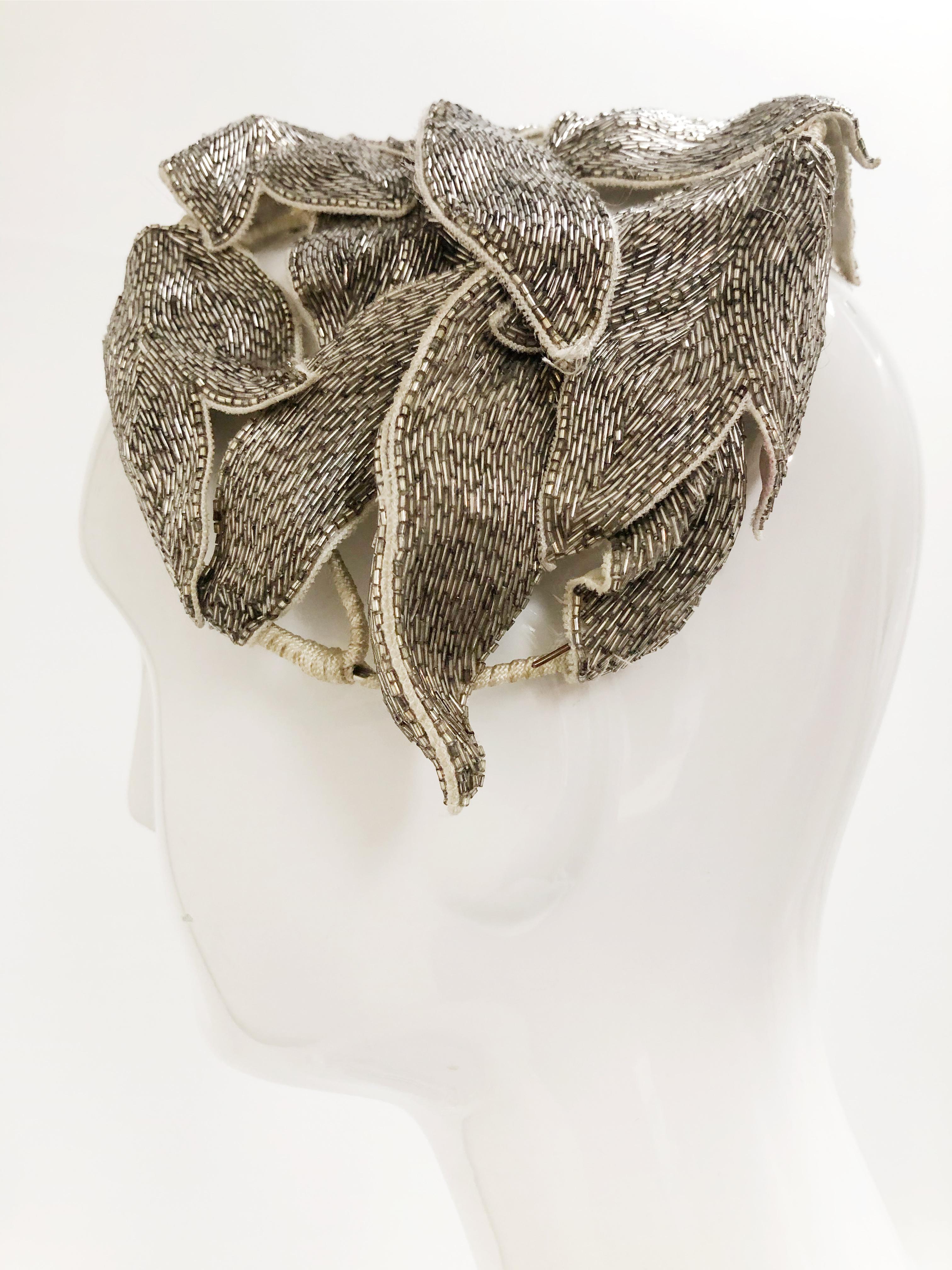 1950s restyled Maggie Norris close-fitting silver bugle bead covered leaf hat. Nicely made with covered wires for structure under applique leaves. 