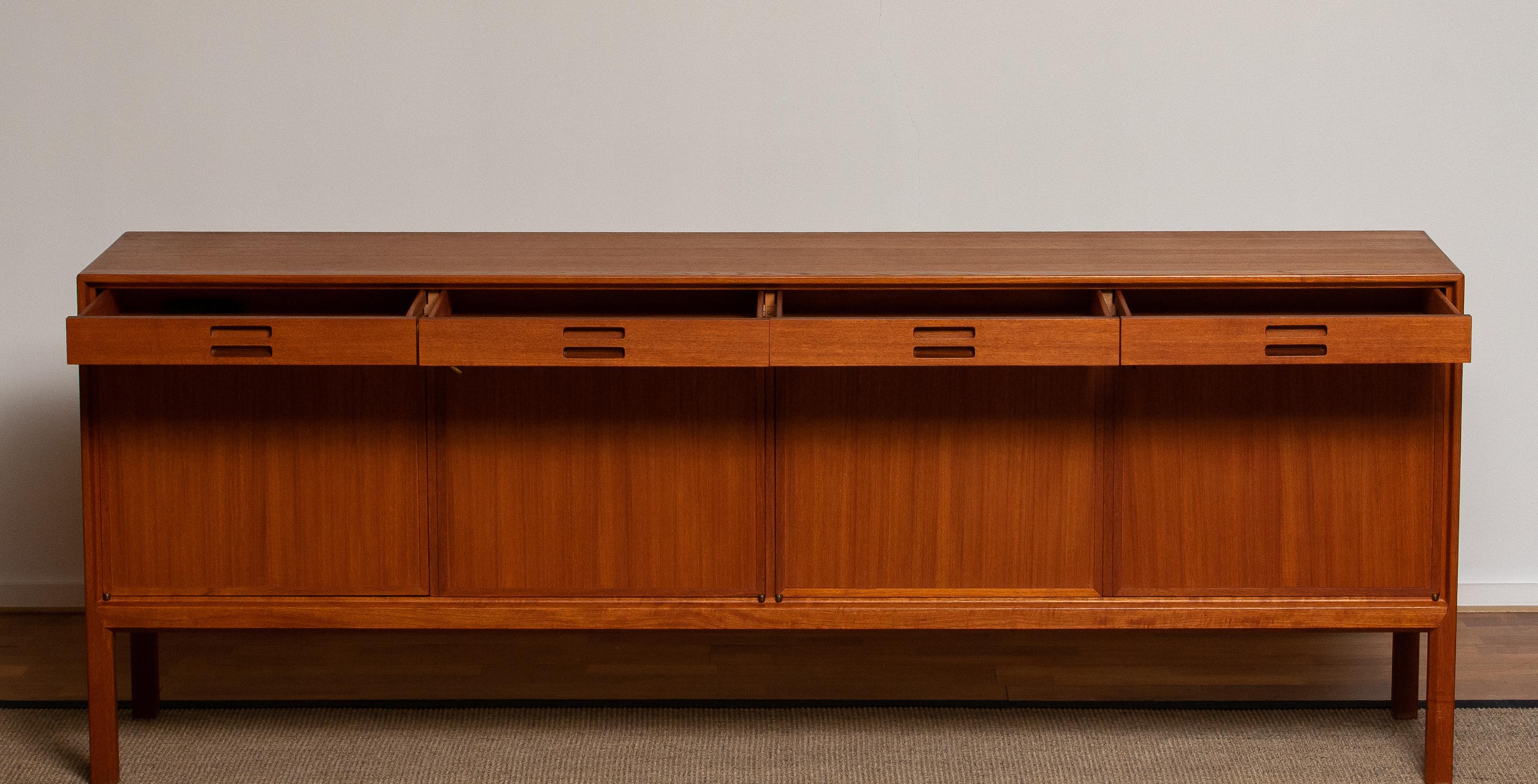 Two identical beautiful sideboards or credenzas designed by Bertil Fridhagen for Bodafors Bra Bohag from Sweden. These two identical sideboards are both made of teak.
Both are in excellent condition. Period 1950s.
Additional photos, Sure. Just let