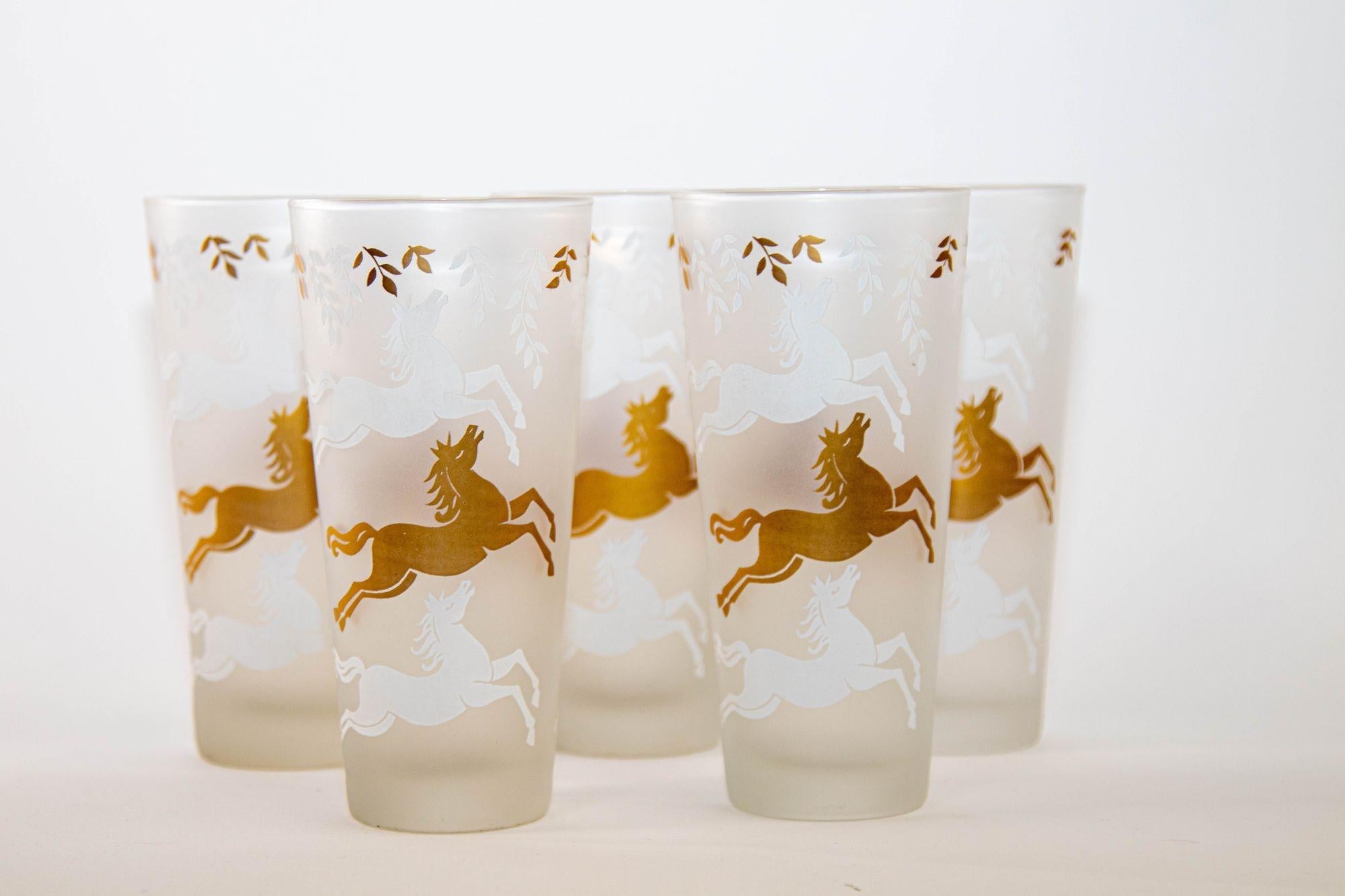 1950s Cavalcade by Libbey Galloping Horse Tumbler Glasses Gold and frosted white, set of 5.
Set of Mid-Century Modern frosted horse high ball tumblers glasses frosted white and gold toned cavalcade of stallions.
Fabulous and fun set to enjoy a