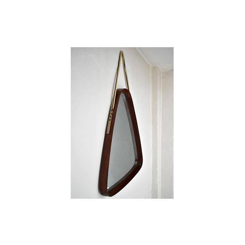 Vintage mirror dating back to the 1950s, Italian manufacture.
The mirror has a triangular teak wood frame with a thickness of 5cm.
The mirror can be hung on the wall with the hanging rope visible in the photos.
In the photo you can see a slight