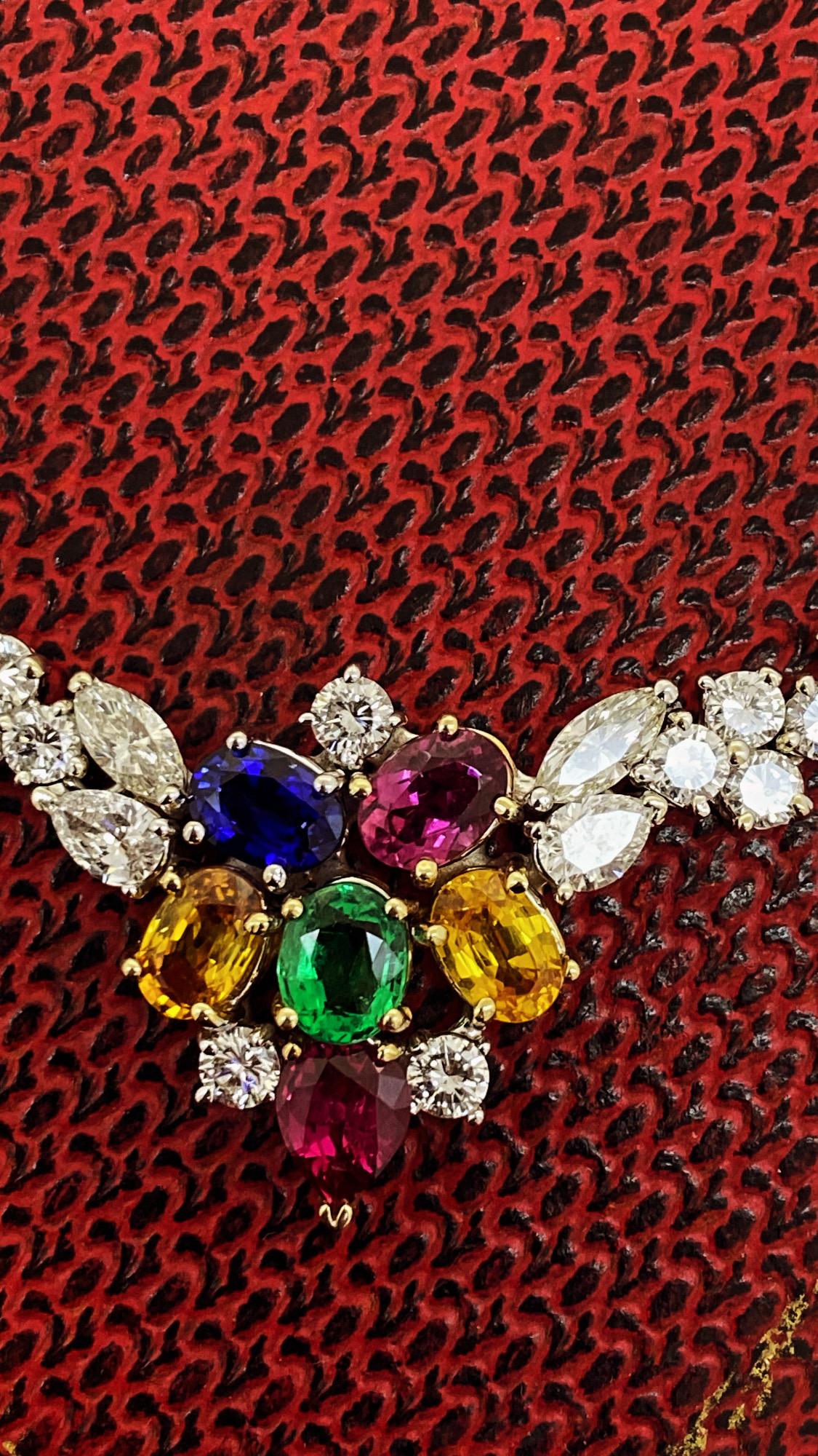 This truly breathtaking Piece of Finest Jewelry is
an Eternity Tennis Necklace
lavishly set with natural 220 sparkling diamonds & 
features an impressive cluster of 
coloured precious stones of finest quality: 
Emeralds, Rubies & Sapphires 

Of