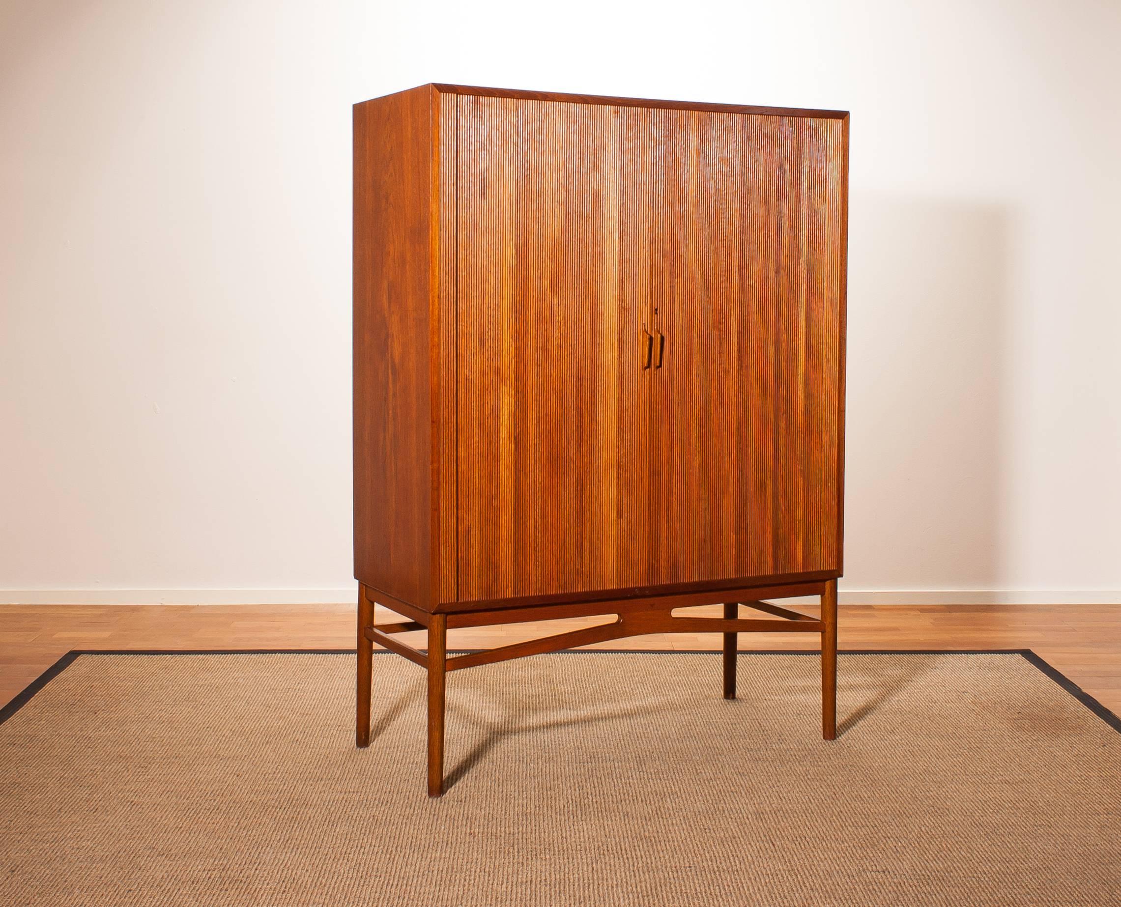 Beautiful teak archive cabinet designed by Carl-Axel Acking.
This cabinet has two wonderful tambour sliding doors and inside there are twelve large archive drawers made of beech.
It is in a very nice condition.
Period 1950s
Dimensions: H 146 cm,