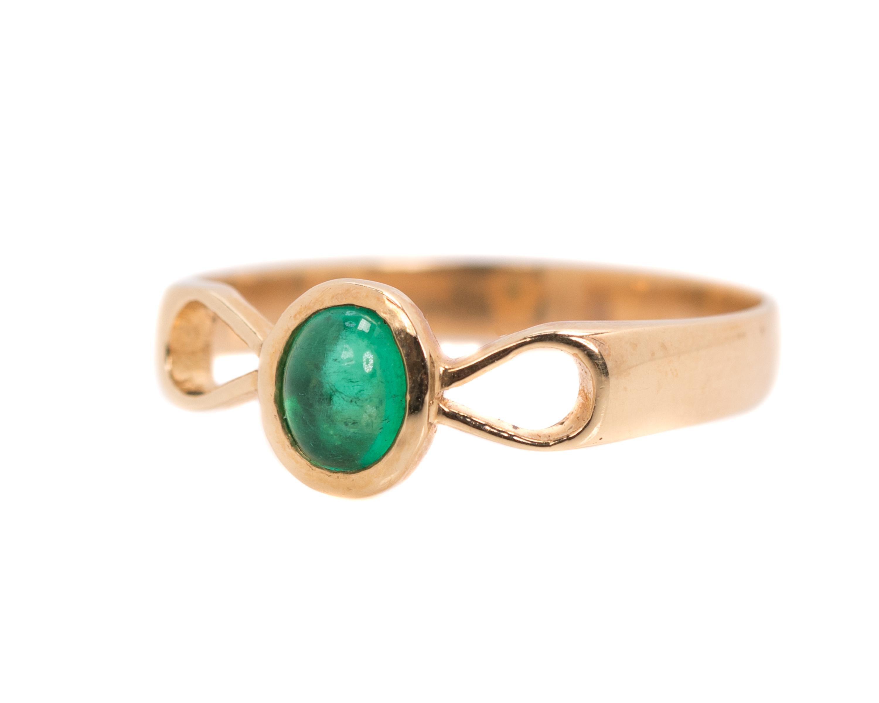 1950s Retro Emerald Cabochon Ring - 18 Karat Yellow Gold, Emerald

Features:
0.25 carat South American Emerald oval cabochon
18 Karat Yellow Gold setting
3 millimeter shank width
Bow motif with open teardrop shapes flanking center stone

Finger to
