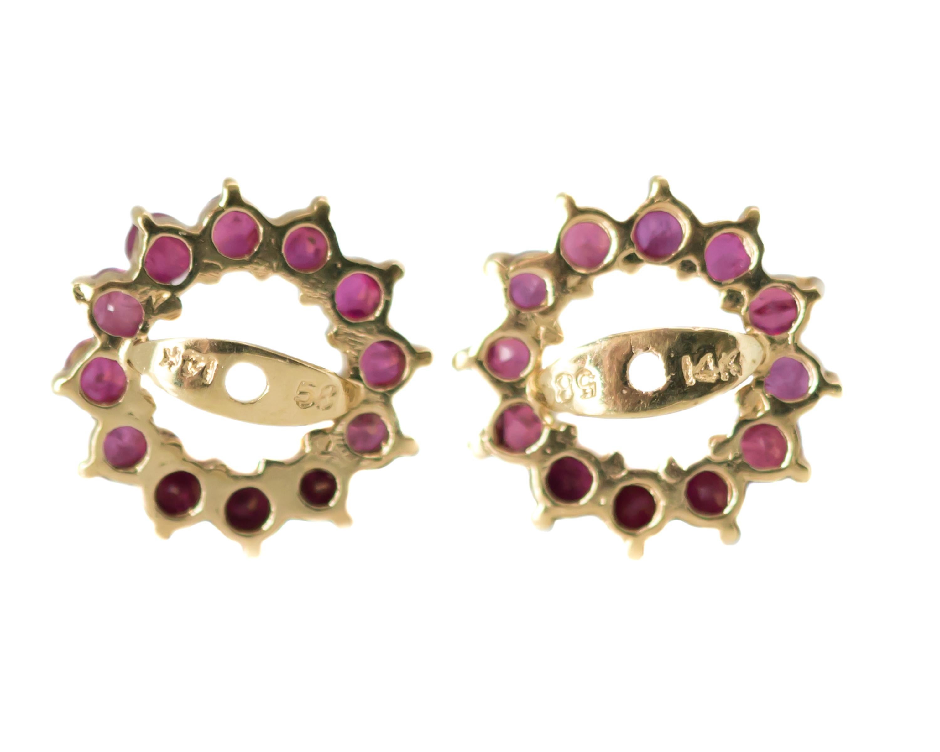 1950s Retro Ruby Earring Jackets - 14 Karat Yellow Gold, Rubies

Features:
0.25 carats total weight Rubies
12 round Rubies per jacket, total 24 Rubies
14 Karat Yellow Gold setting
Prong set Stones
11 millimeters wide
Jackets fit a 0.75 - 1.0 carat