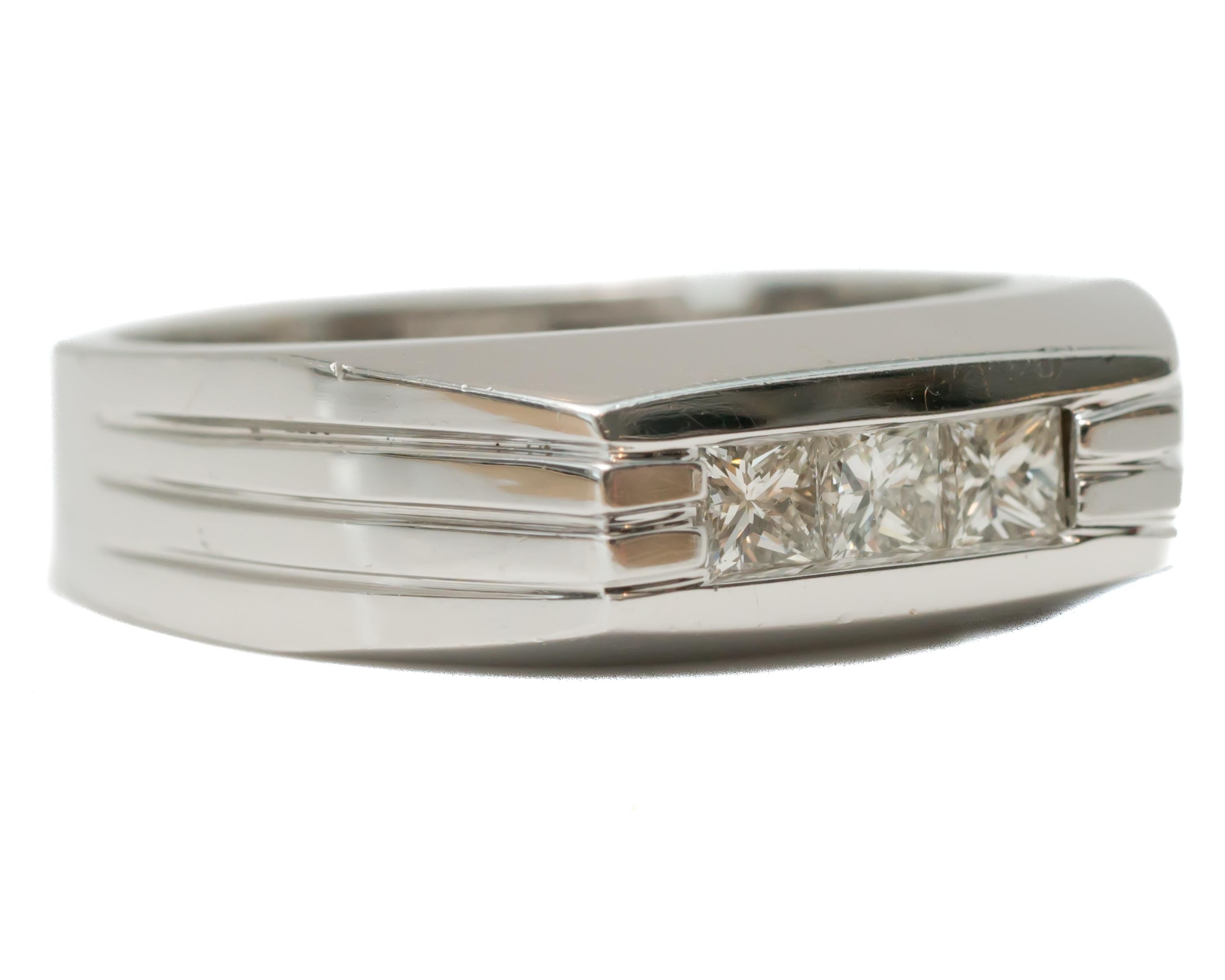 1950s Retro Diamond Band Ring - 14 Karat White Gold, Diamonds

Features:
0.35 carats Princess cut Diamonds
3 Channel set Diamonds
14 Karat White Gold Setting
Sleek, Modern Design
Band Width tapers from 7 - 4.75 millimeters
Finger to top of ring