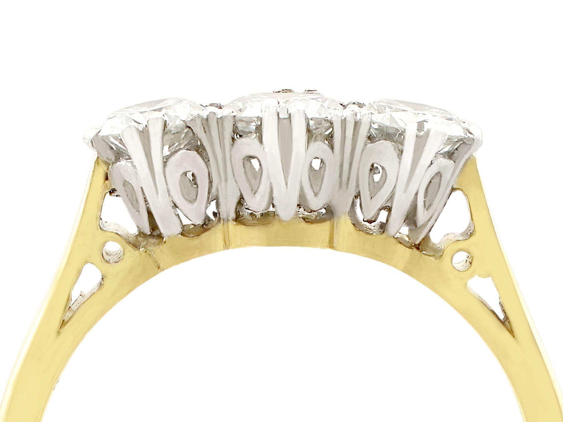 An impressive vintage 0.83 carat diamond and 18 karat yellow gold, platinum set trilogy style engagement ring; part of our diverse diamond jewelry and estate jewelry collections.

This fine and impressive three stone ring has been crafted in 18k