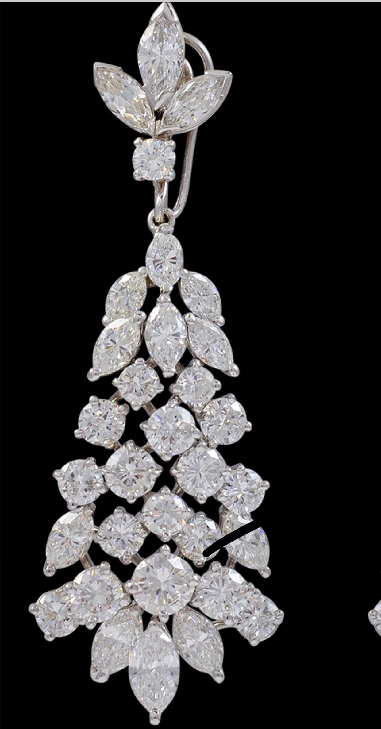 A fabulous pair of earrings with an enormous amount of look and sparkle!
These exquisite pair of earrings features round and Marquise diamonds of substantial size. diamonds which are set with the prongs , 
They feature a graduating cascade design
