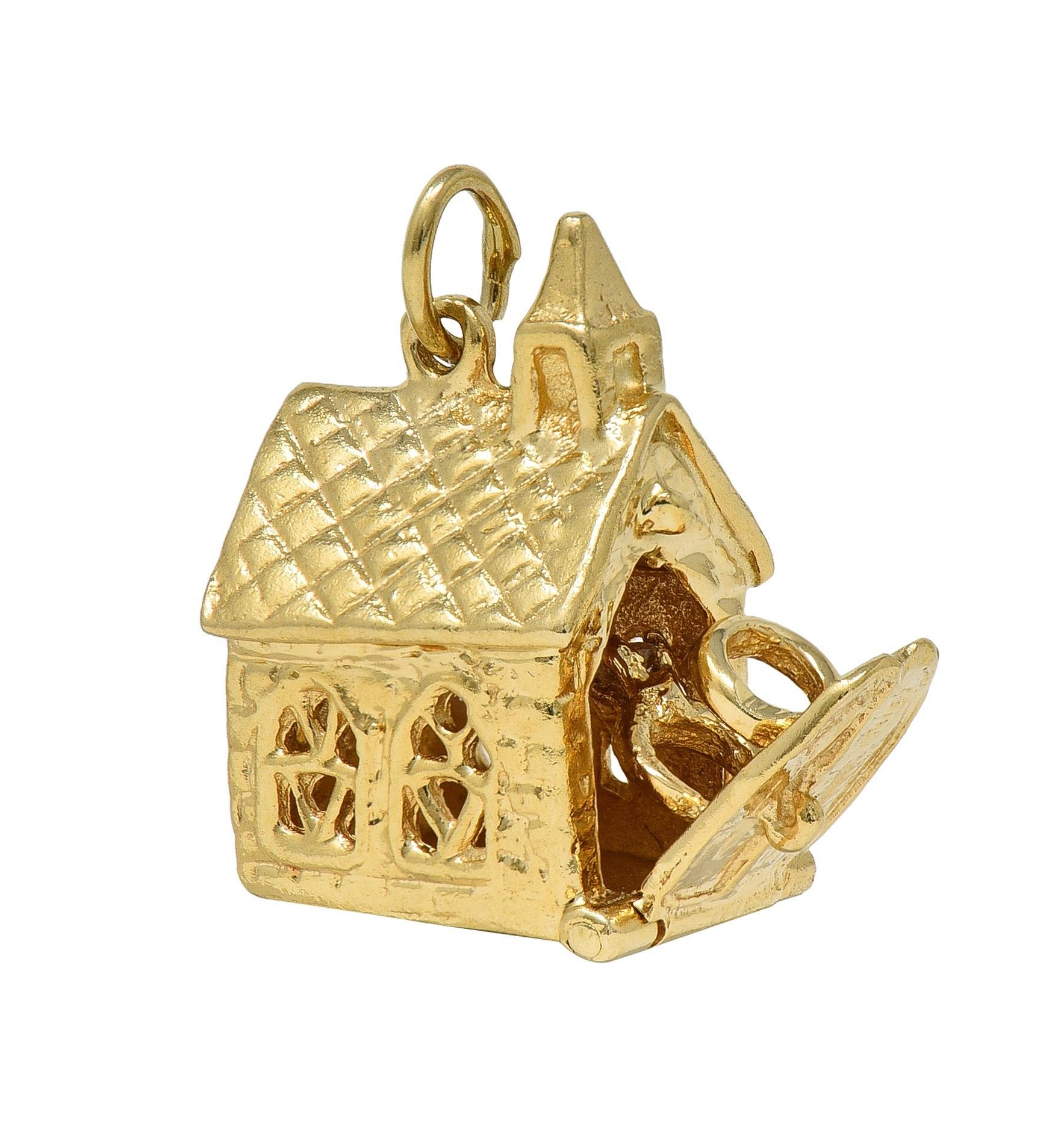 Designed as a highly rendered chapel with pierced gothic windows, steeple, and crosshatch roof
Featuring a functional door that opens on a hinge to reveal an engagement and wedding ring
Accented by a round cut diamond - eye clean and