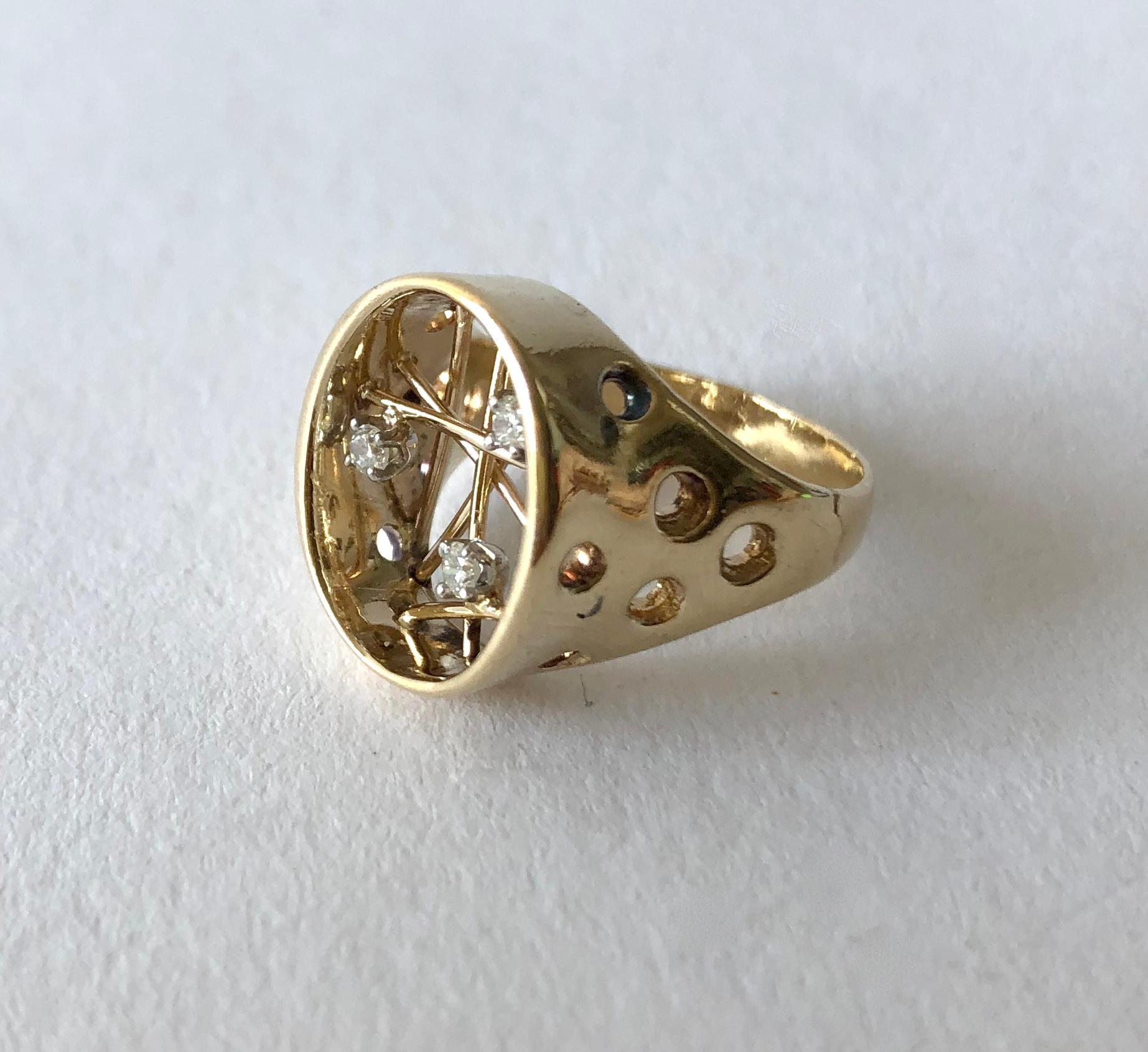 14K gold and diamond atomic sputnik ring, circa 1950s.  Ring is a finger size 5 and could be resized by a competent jeweler if need be.  An interesting alternative to a modern day engagement ring or otherwise. In very good vintage condition. 5.8