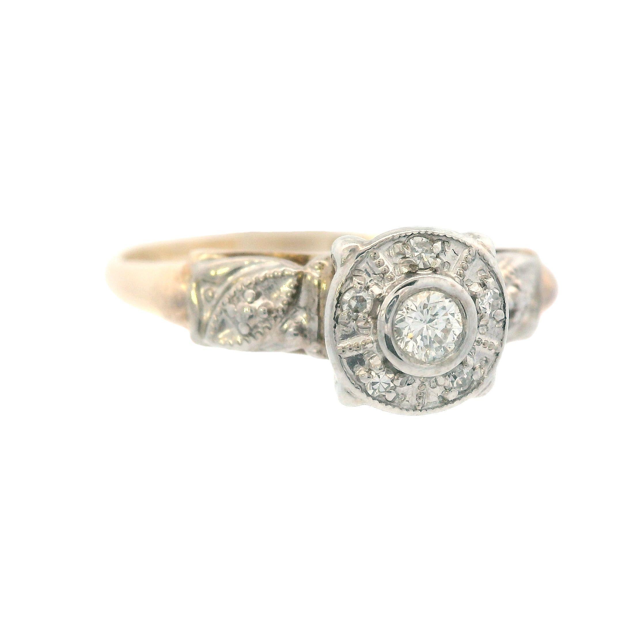 This lovely diamond ring from the 1950s is made with both 14k yellow gold and 14k white gold. The band is made in 14k yellow gold and the head is made in 14k white gold, which matches perfectly with the sparkly white diamonds. This ring is very true