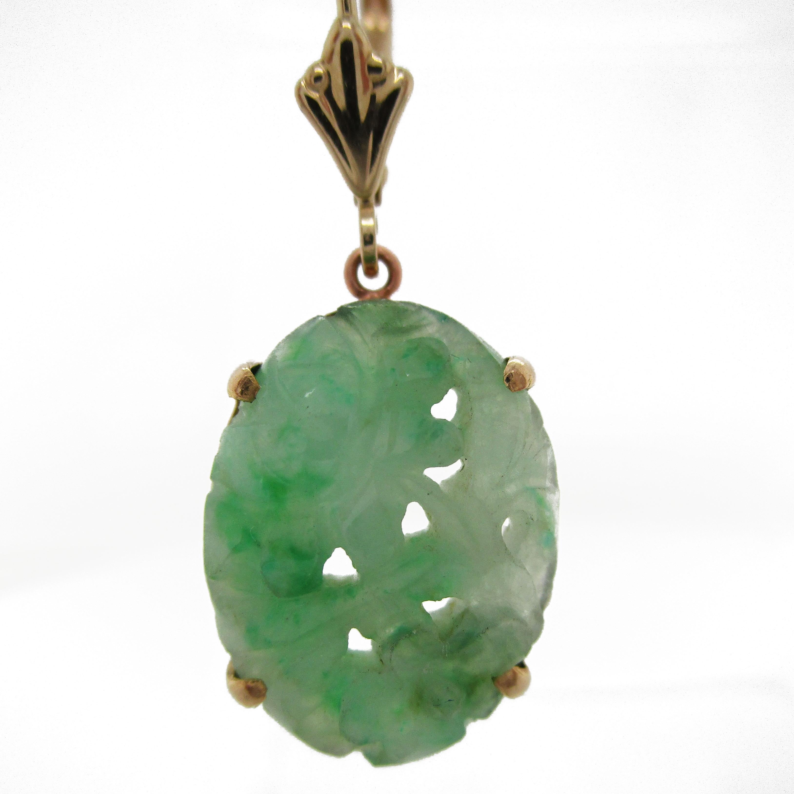 These earrings paint a picture of a setting sun over a quiet garden, with the leaves rustling softly and the smell of flowers sweet in the air. The jadeite drops are hand carved and fully translucent with an enchanting pale green color. The frame