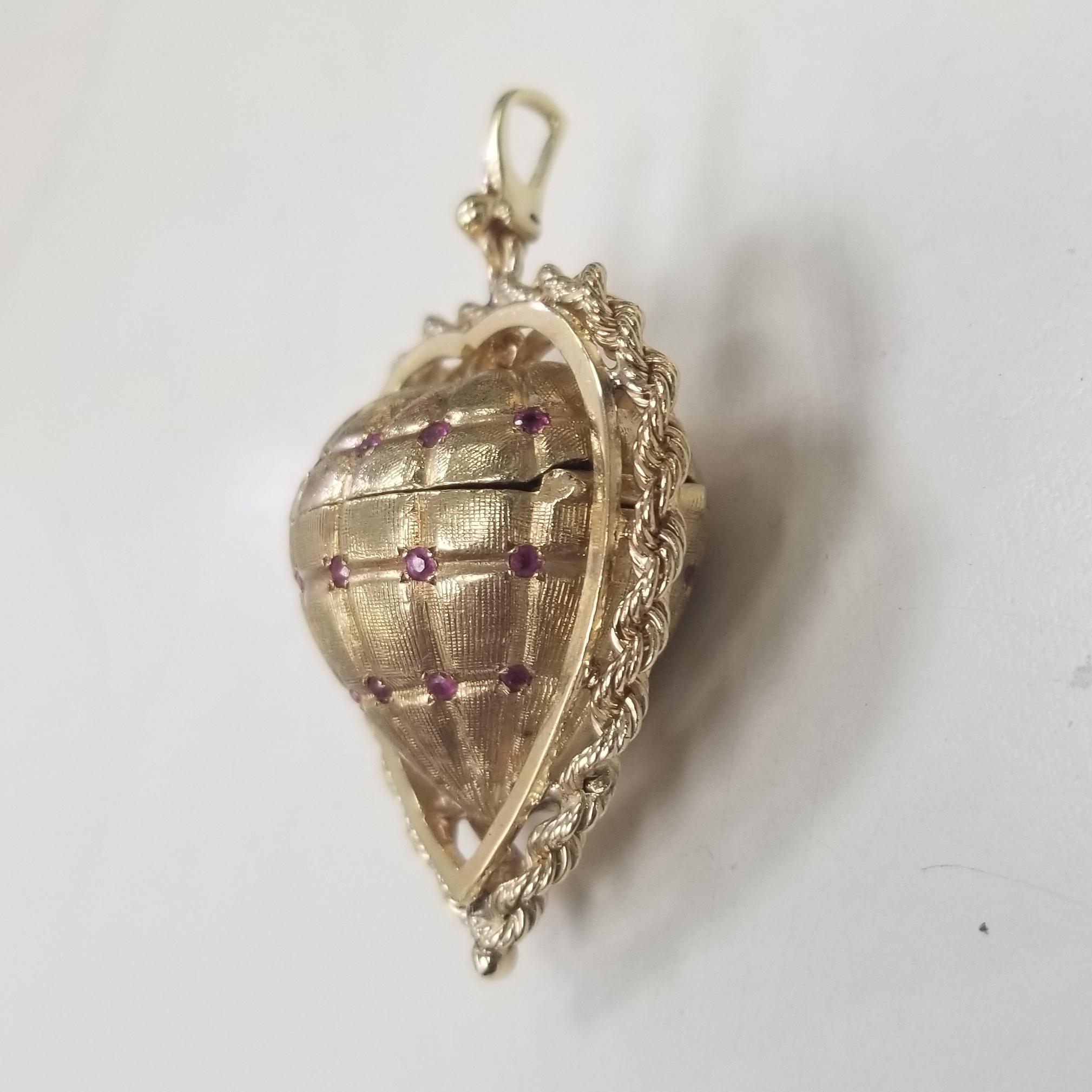 1950's 14k yellow gold Heart pendant locket that holds 3 pictures inside with rope trim.  
Item specifics
Condition:Pre-owned:
Seller Notes:“GREAT CONDITION”
Type: Pendant-Locket
Main Stone Color: 30 Rubies .45pts.
Metal Purity:14k
Metal:Yellow