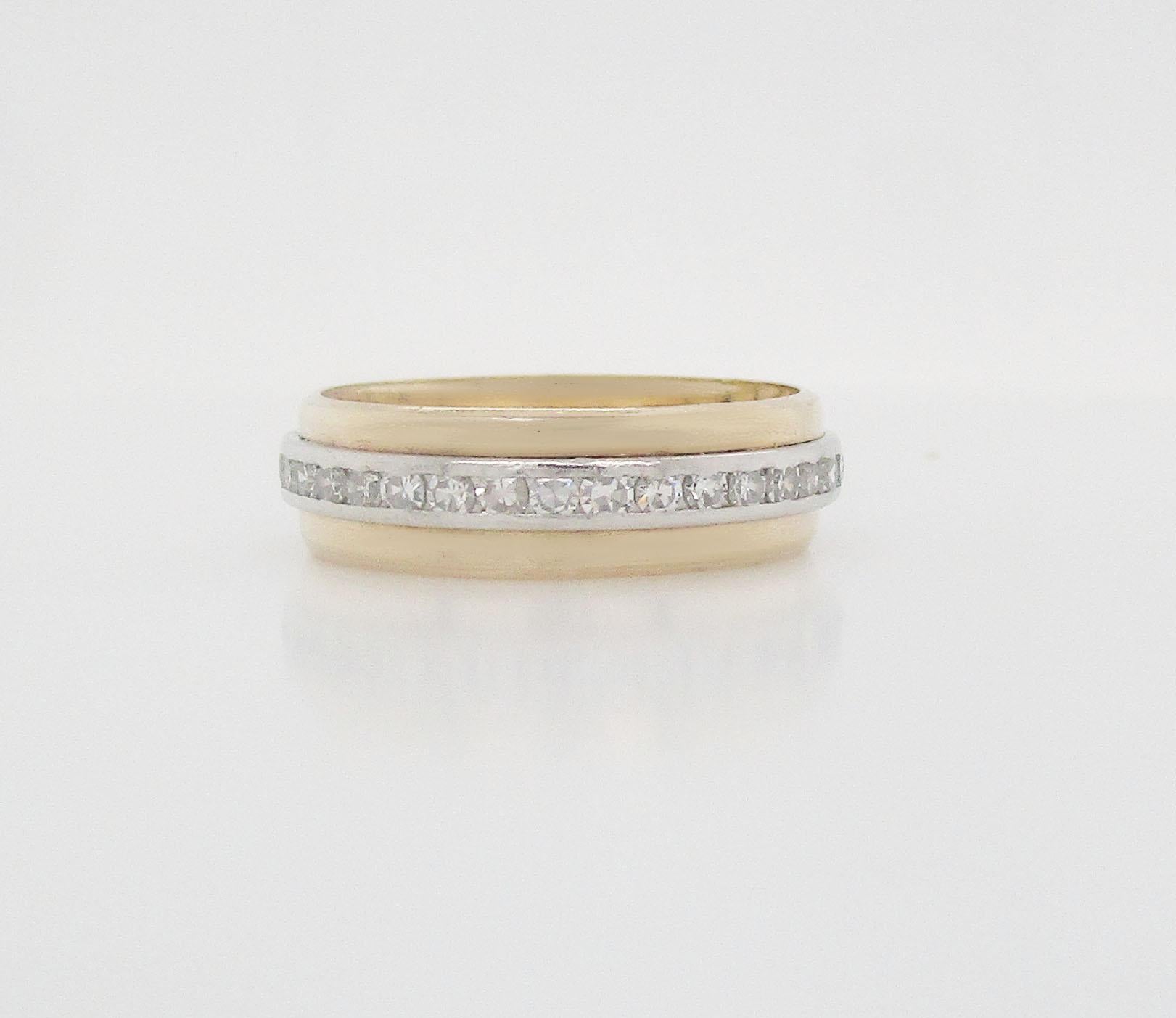 This is a beautiful platinum and 14k yellow gold eternity band. This ring is from about 1940-50. It’s a great band with two bands of yellow around a platinum band to create a layered look. This is the perfect stacking band because, with this one
