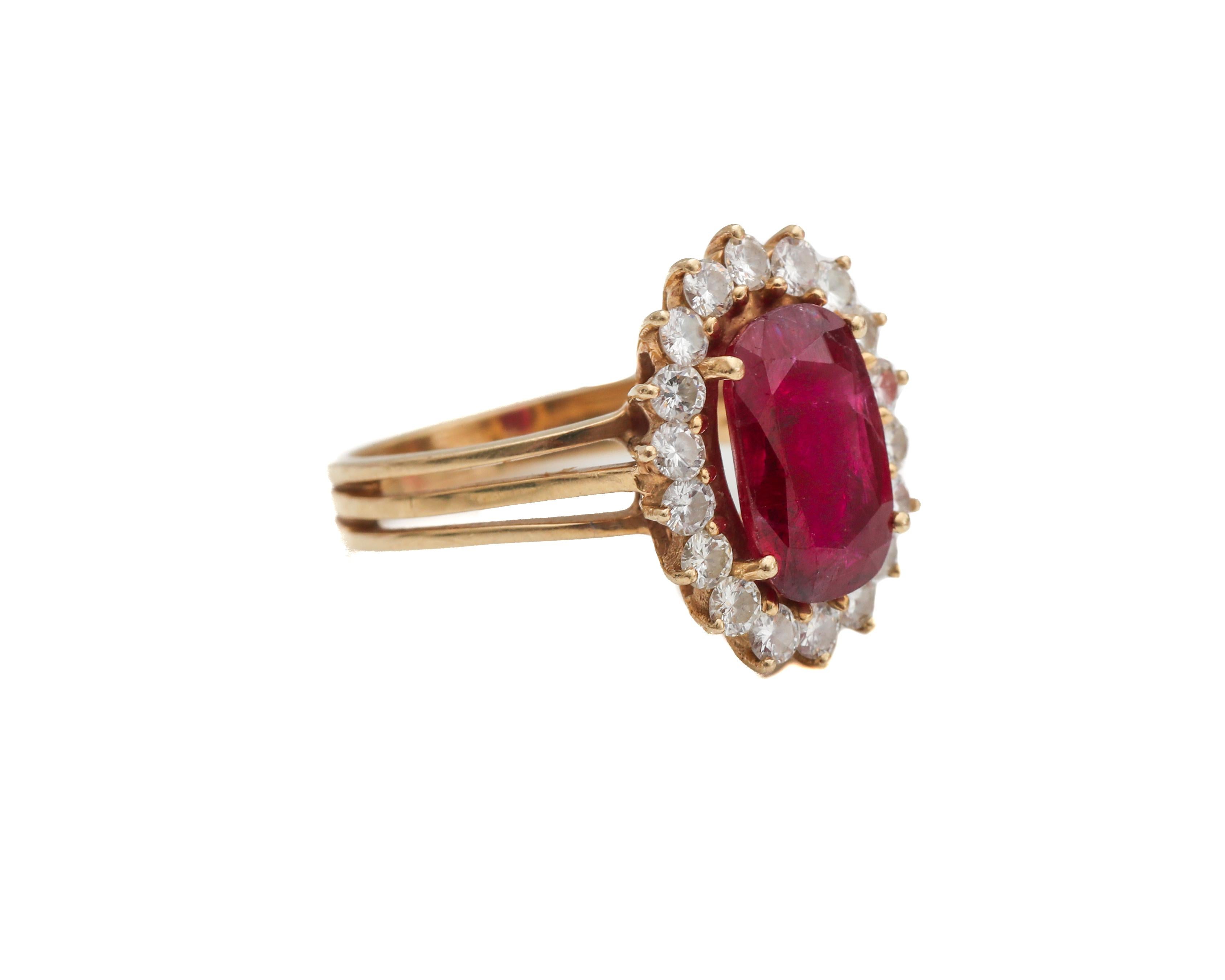 Absolutely stunning Ruby and Diamond Ring from the 1950s. This ring features a 1.5 carat Ruby, oval cut, 4-prongs and is surrounded by a sparkling halo of diamonds, 0.25 carats approximately. All Diamonds are also prong set, and boast H color VS