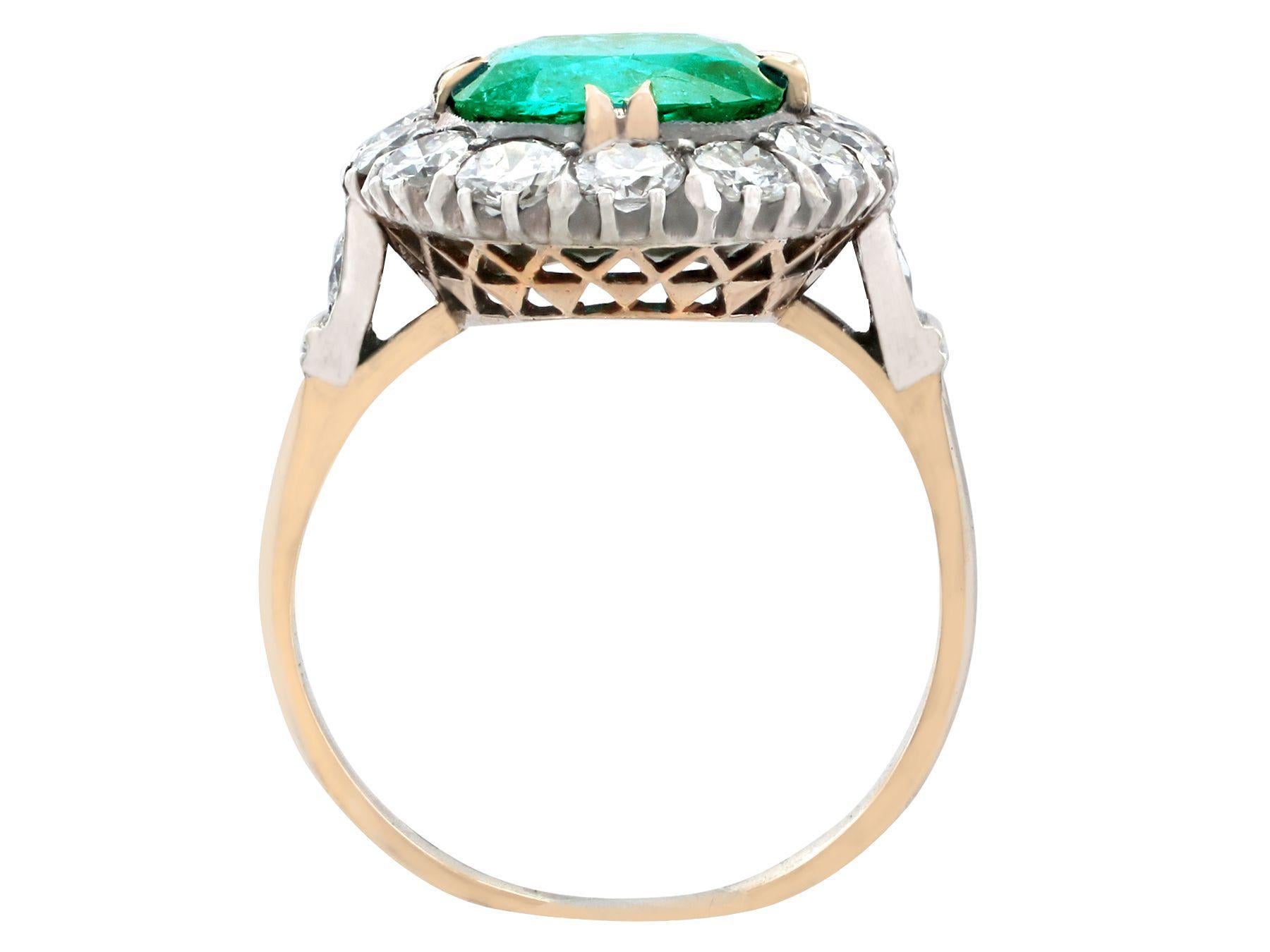 1950s 1.74 Carat Oval Cut Emerald and Diamond Yellow Gold Cluster Ring 3