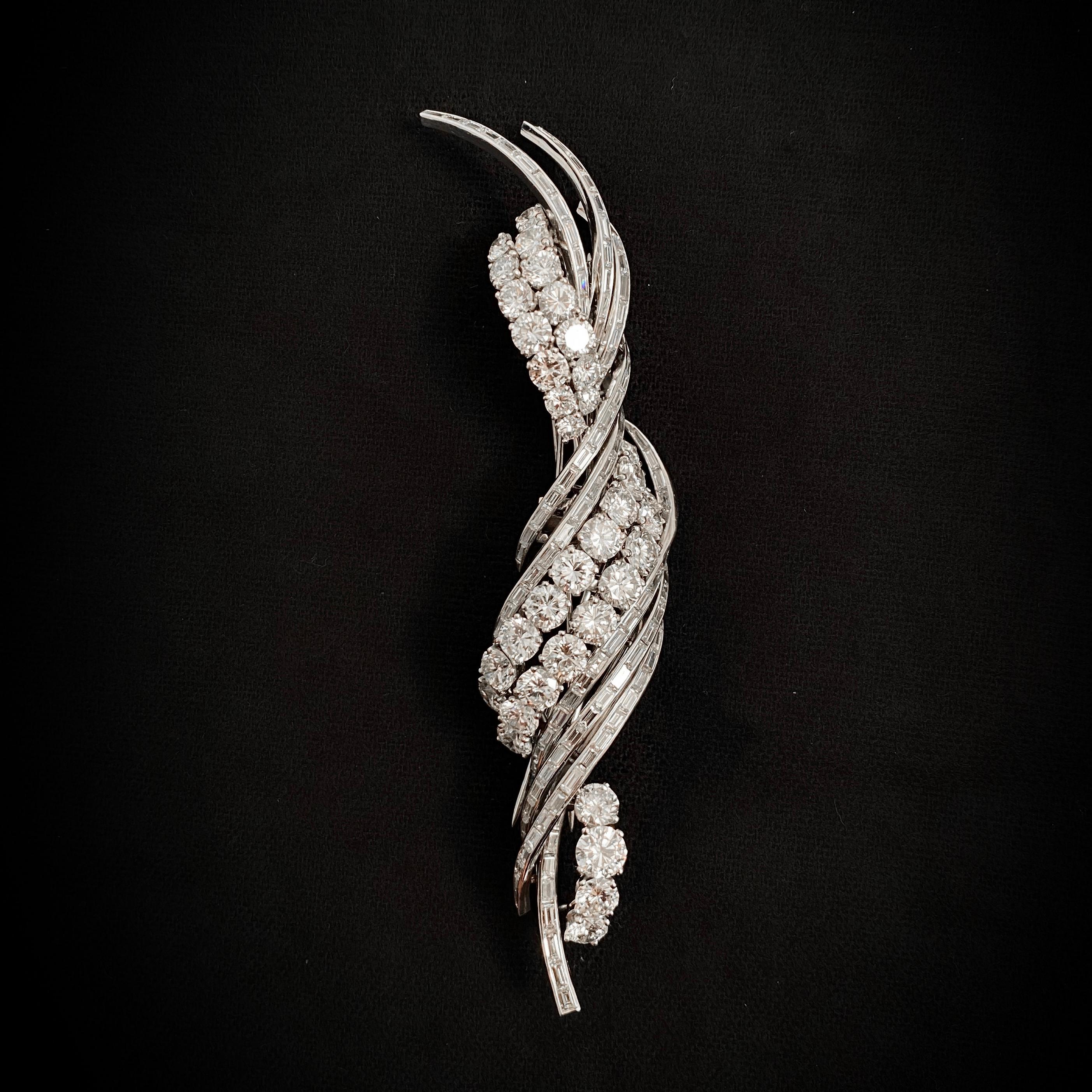 1950s 17ct Diamond Floral Spray Double Clip Convertible Brooch in Platinum. A statement piece for anyone who loves the sparkliest diamonds. This brooch is modeled as a stylized floral spray of a naturalistic twisted design, seamlessly set throughout