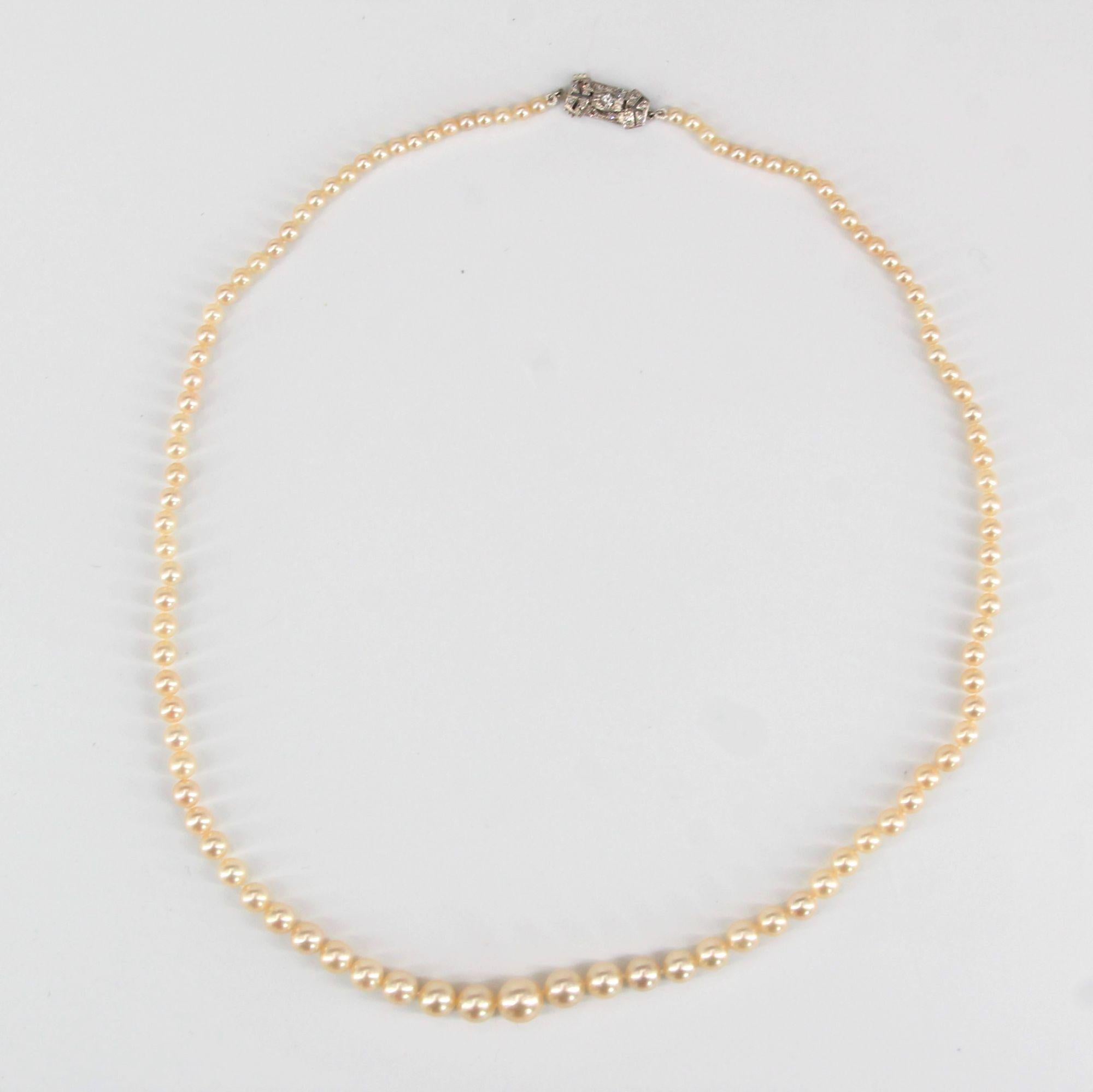 1950s 18 Karat White Gold Diamonds Clasp Falling Pearl Necklace For Sale 1