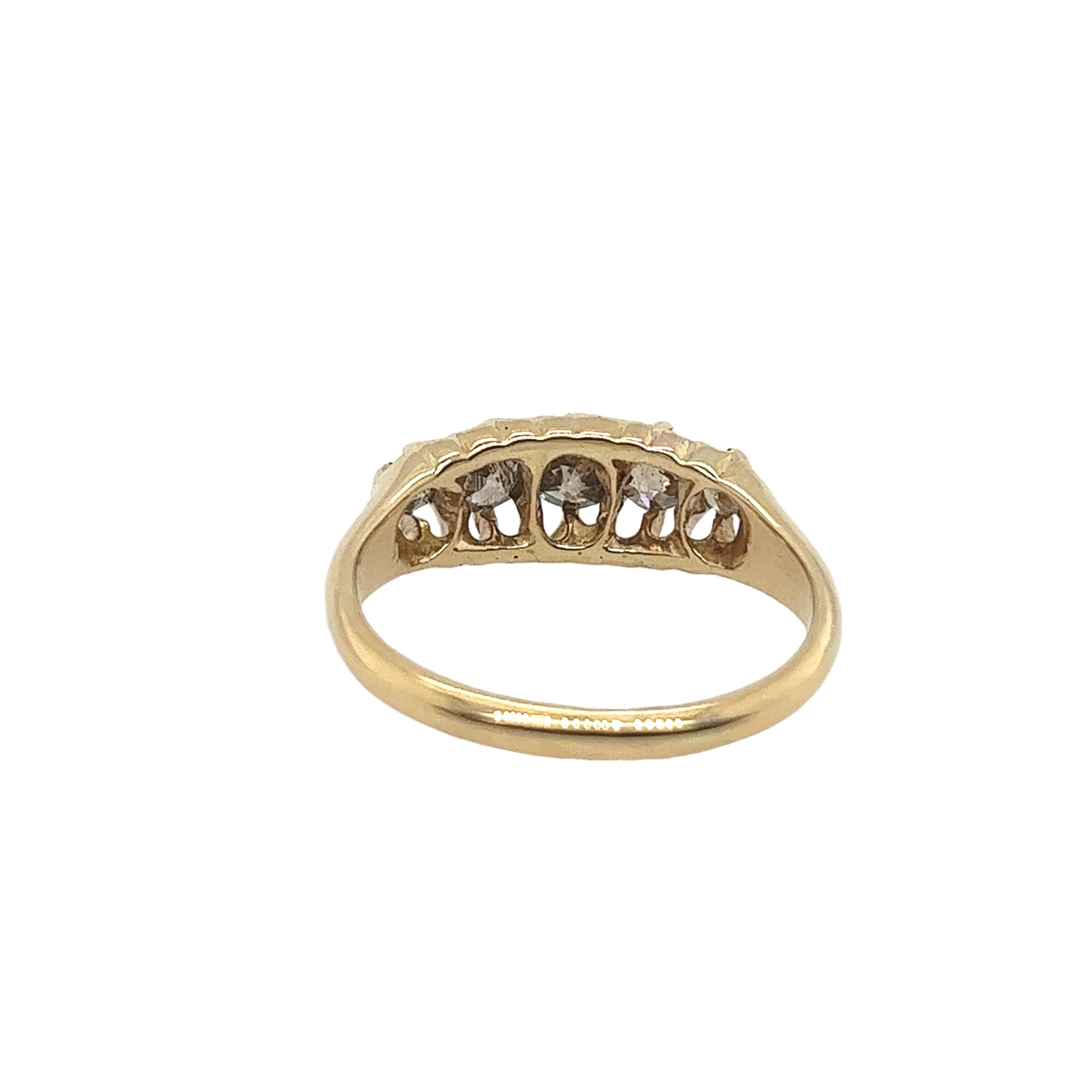 An elegant pre 1950's 5-stone diamond ring, set with 5 round brown diamonds, in an 18ct yellow gold setting.

Total Diamond Weight: 0.40ct
Diamond Colour: brown
Diamond Clarity: SI1
Width of Band: 1.95mm
Width of Head: 6.11mm
Length of Head: