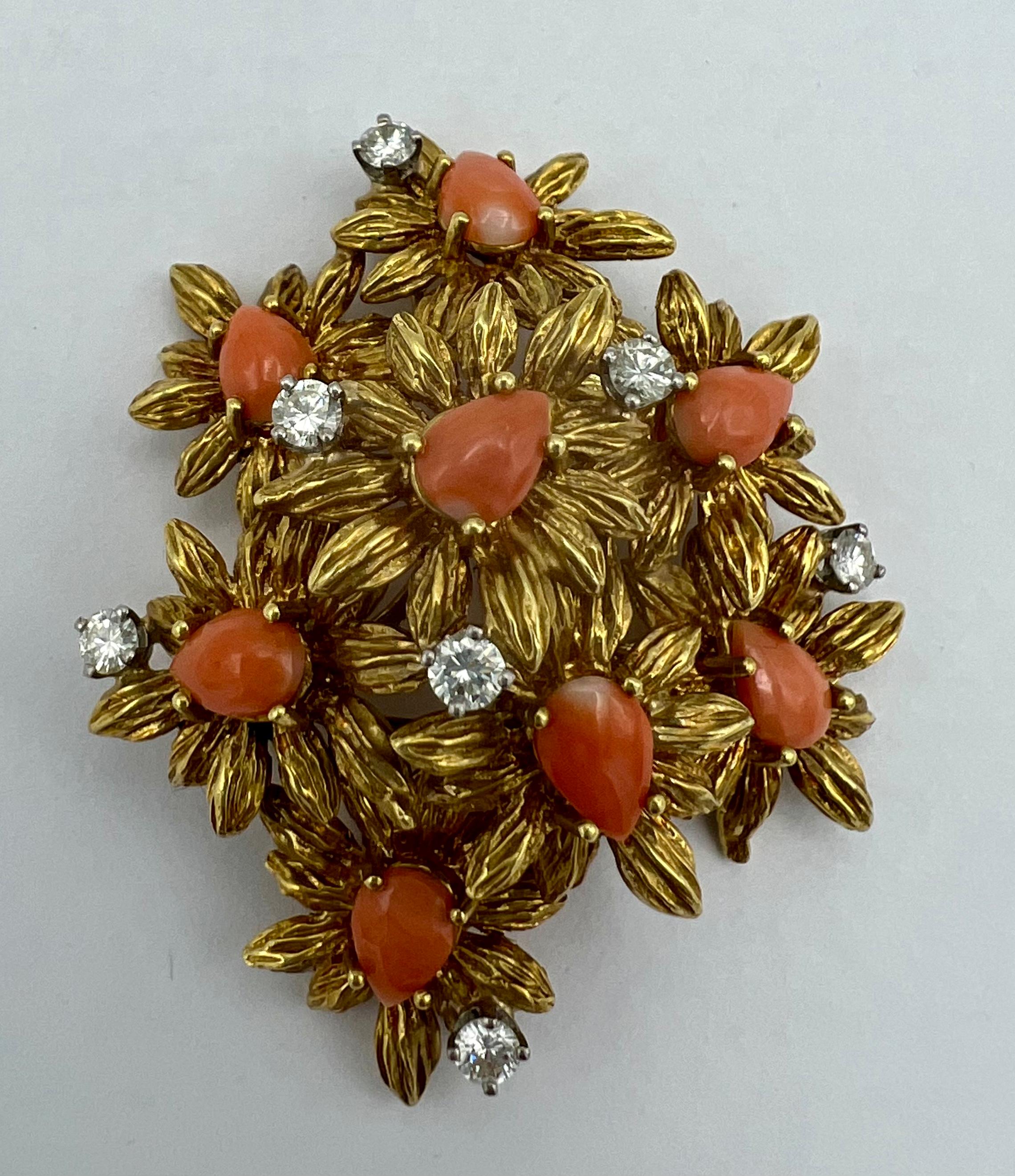 CIRCA: 1950’s
MATERIALS: 18k Yellow Gold
GEMSTONE: 0.91 cts. Diamond
GEMSTONE 2: Coral
WEIGHT: 33.3 grams
MEASUREMENTS: 2- 1/8” x 1- 3/4”
ITEM DETAILS:
An amazing 18k gold, coral and diamond floral brooch

This vintage gold brooch is designed as a
