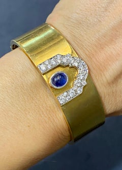 1950s 18k gold cuff with diamonds and cabochon sapphire