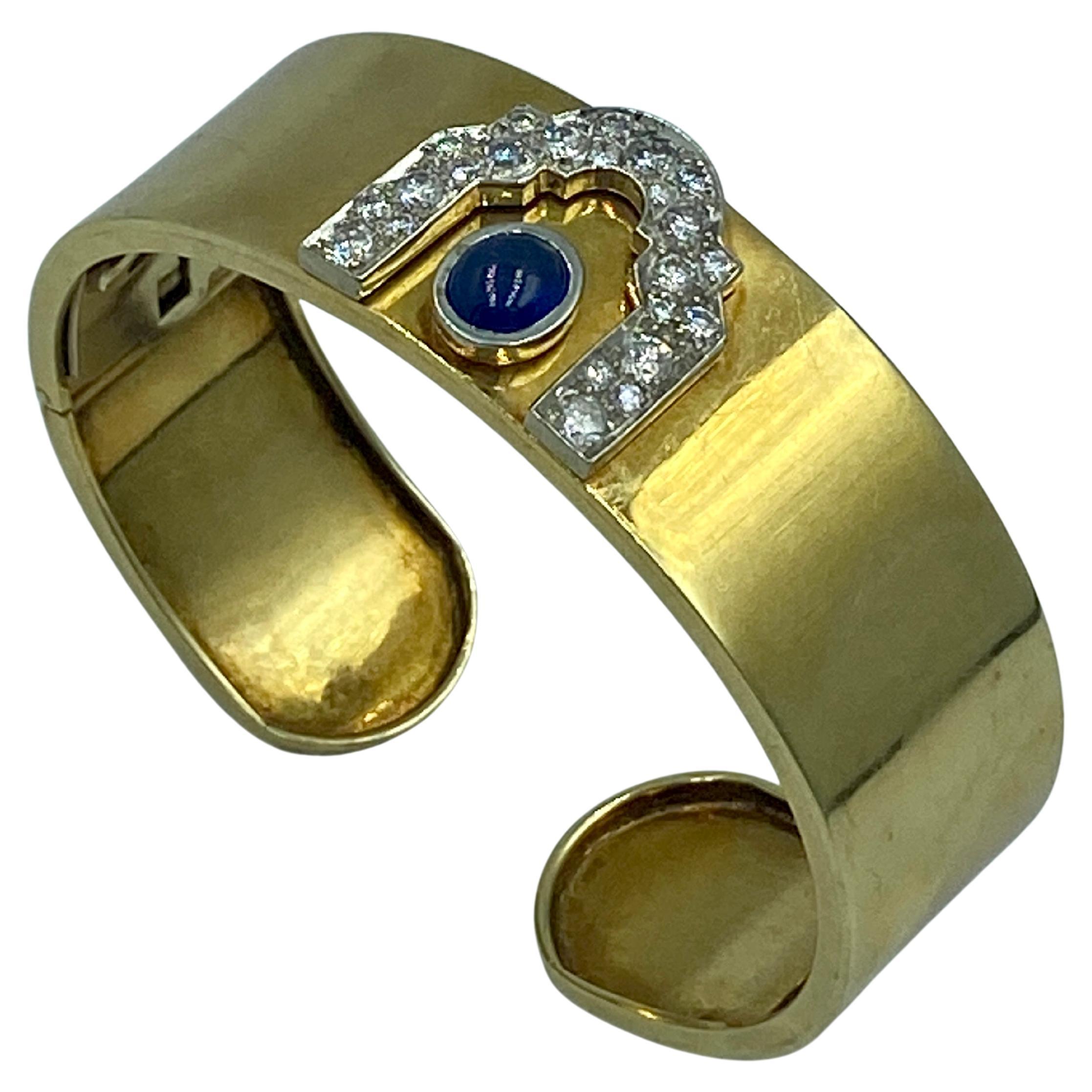 1950s 18k gold cuff with diamonds and cabochon sapphire