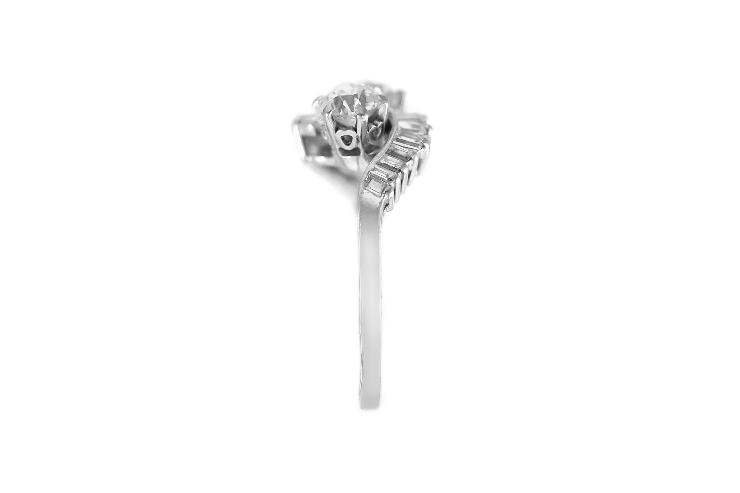 The ring is finely crafted in 18k white gold with two round diamonds weighing approximately total of 1.60 carat and emerald cut diamonds weighing approximately total of 0.80 carat.
Size 7.00 ( easy to resize )
Circa 1950.